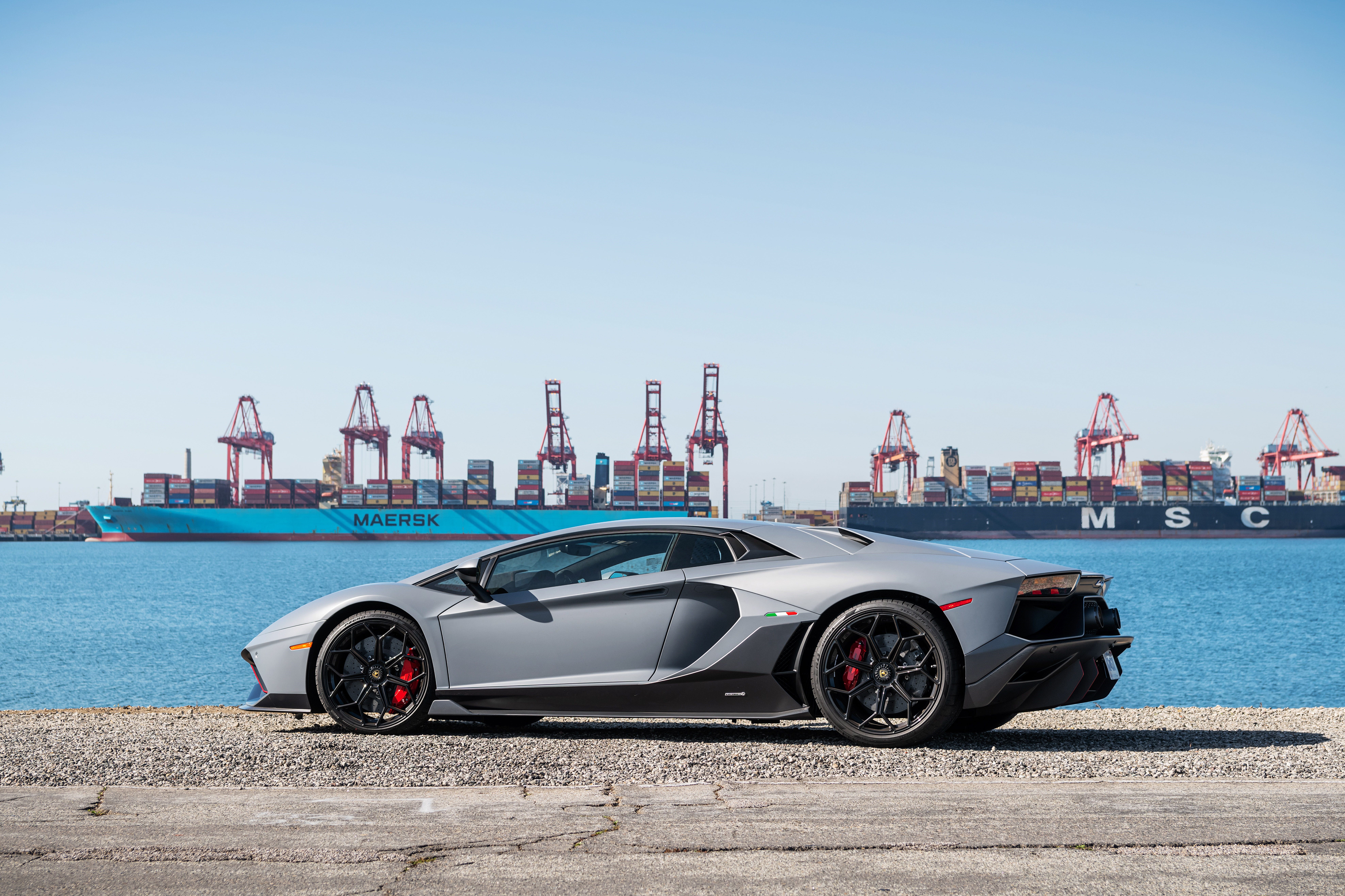 Lamborghini Aventador LP 780-4 Ultimae parked by a port HD Wallpaper