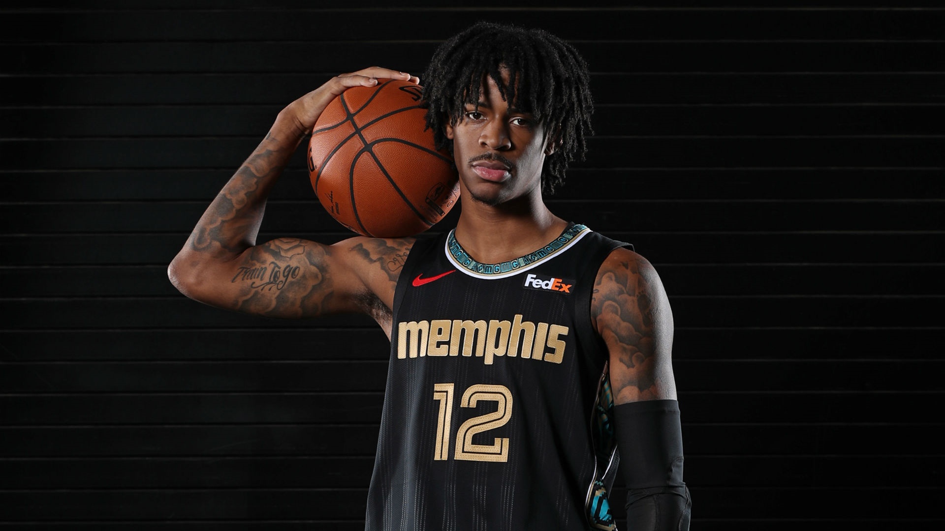 Ja Morant of the Memphis Grizzlies holding a basketball HD Wallpaper