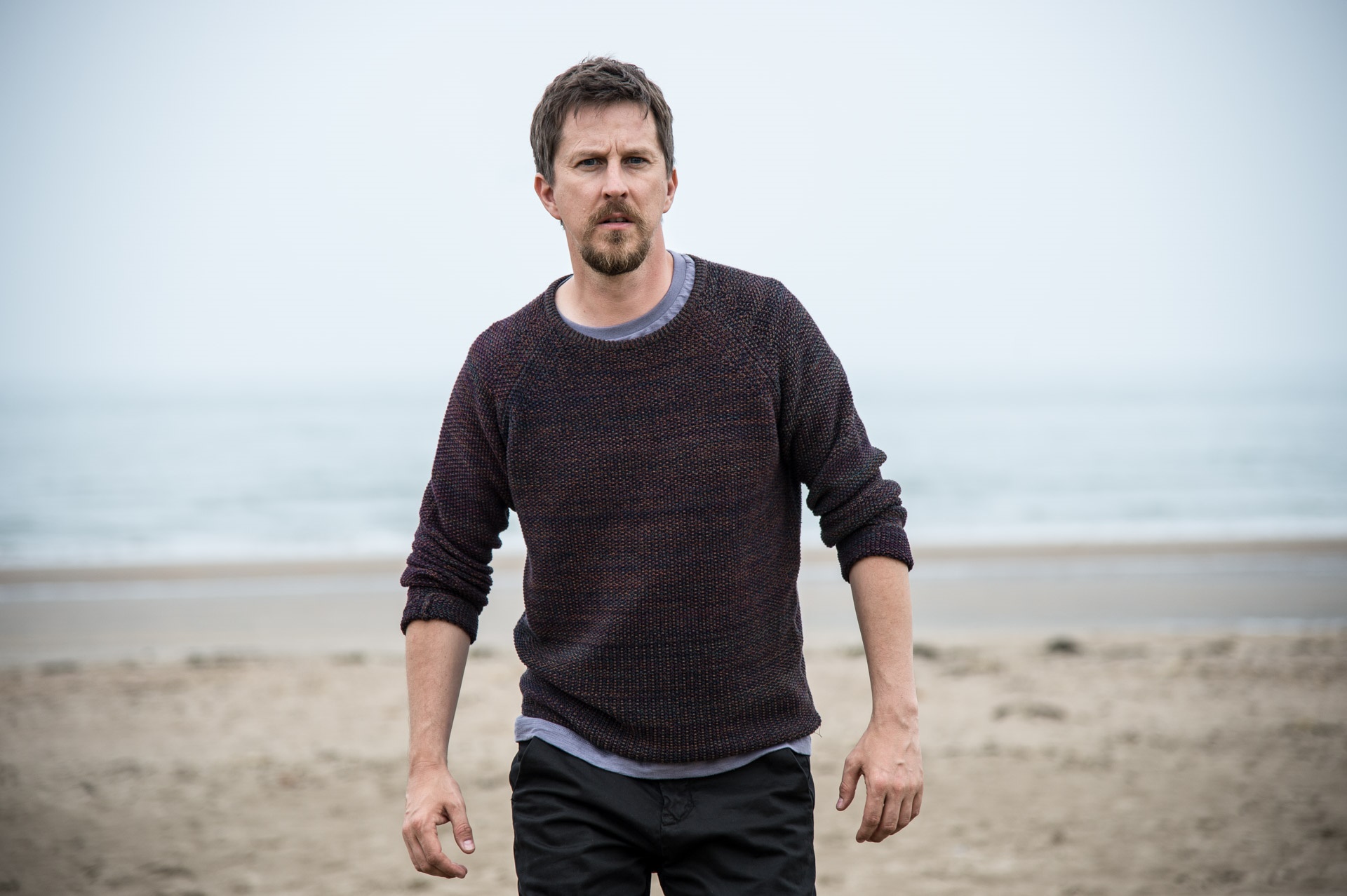 Lee Ingleby on a beach HD Wallpaper
