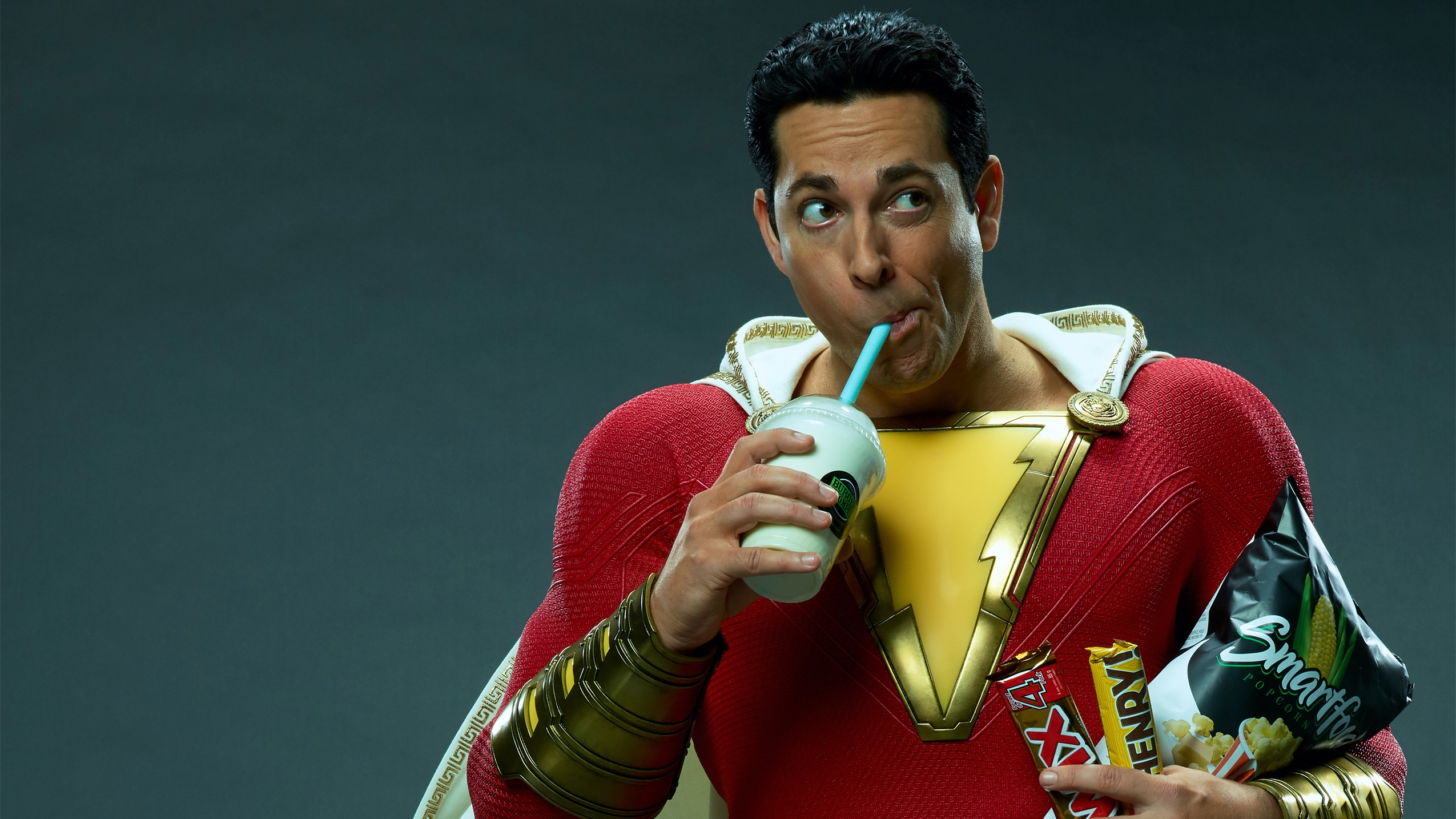 Shazam from DC Comics drinking a milkshake and holding snacks HD Wallpaper