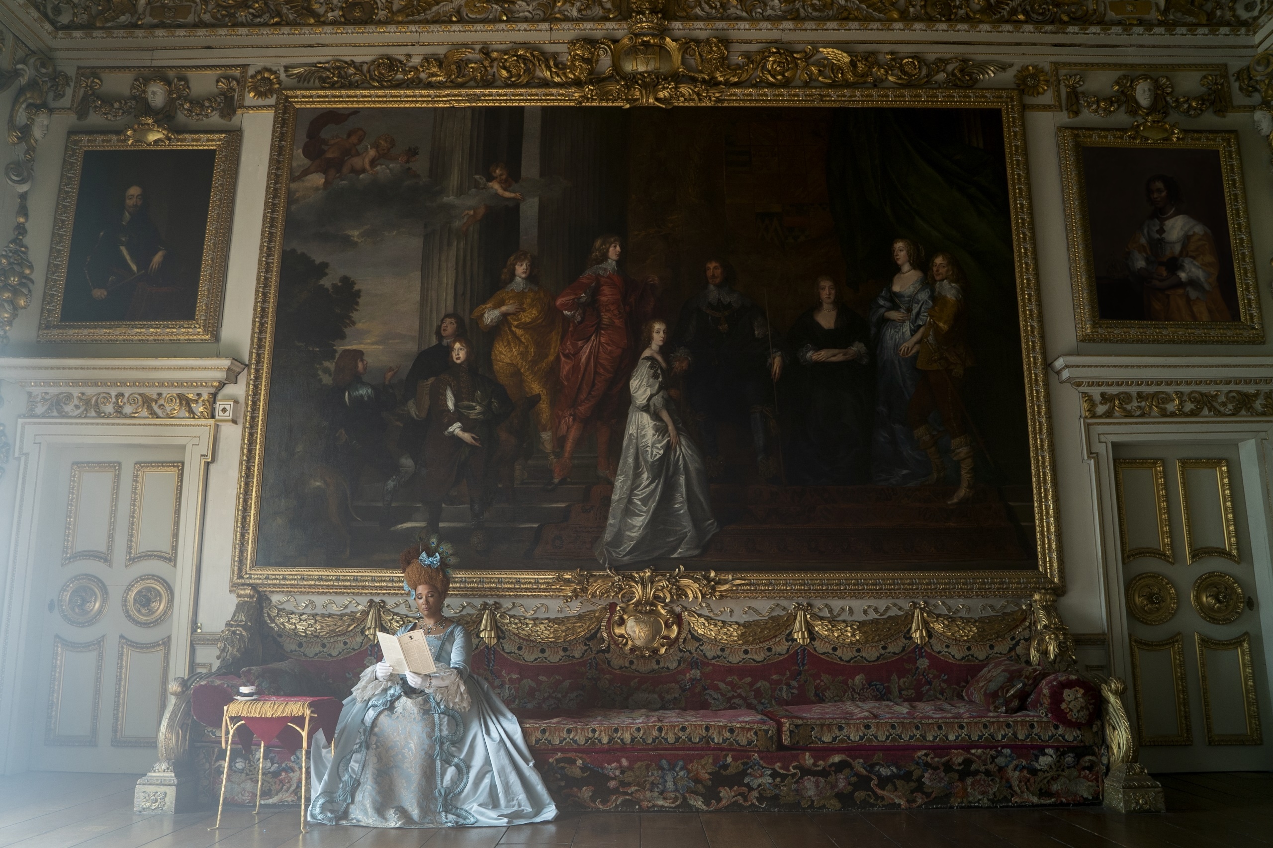 Woman in blue dress reading in opulent room HD Wallpaper