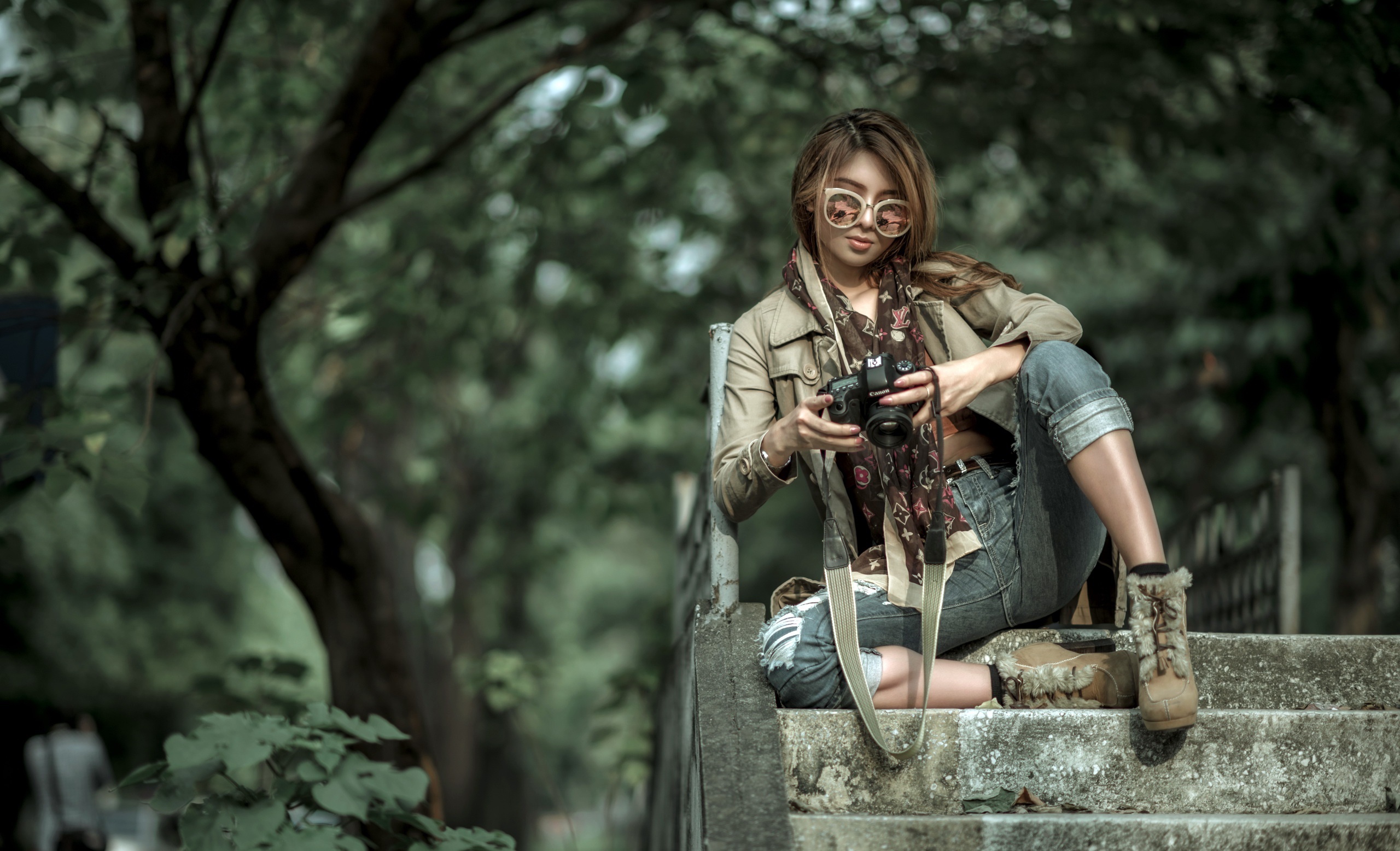 Asian woman with camera sitting on stairs HD Wallpaper