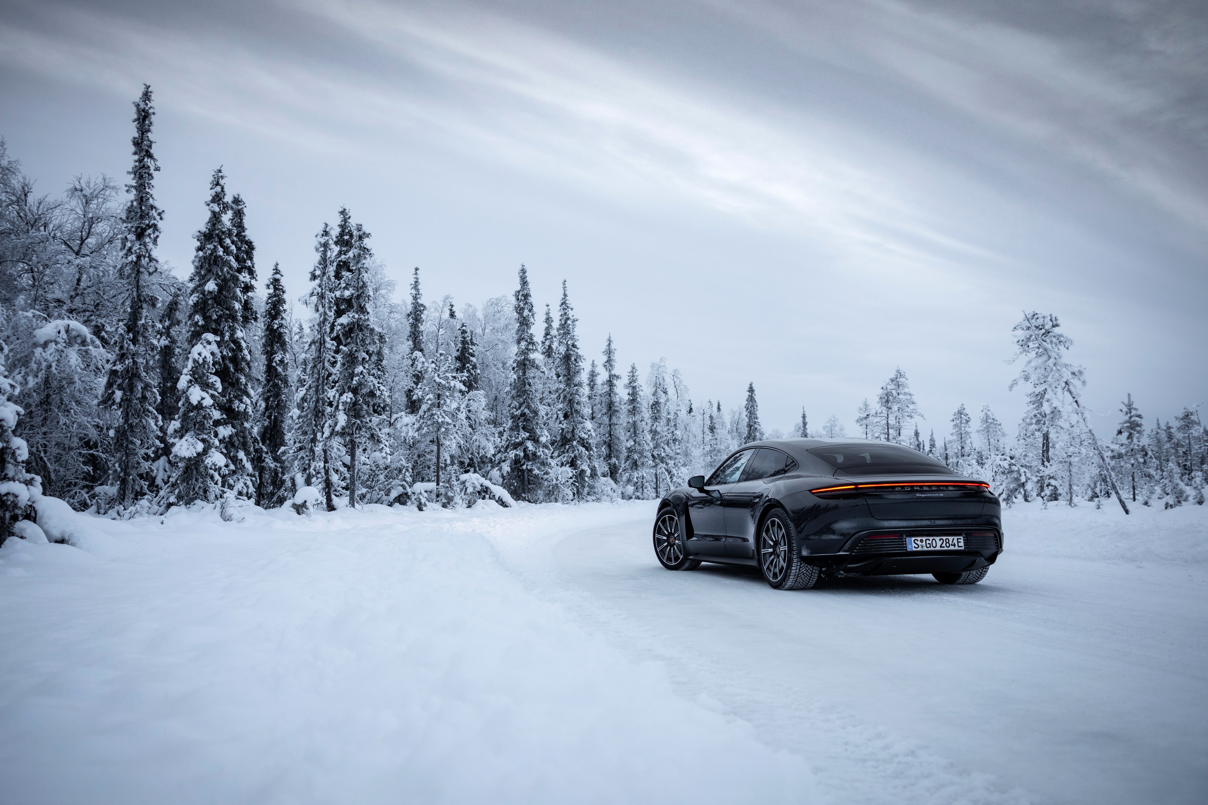 Porsche Taycan 4S in snowy forest 4K HD Wallpaper