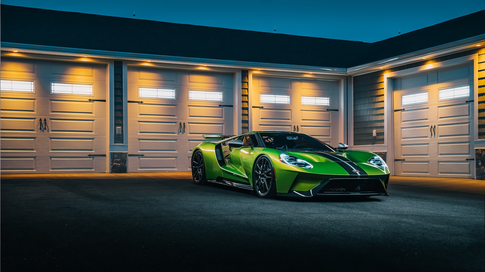 Green Ford GT parked in front of a garage HD Wallpaper