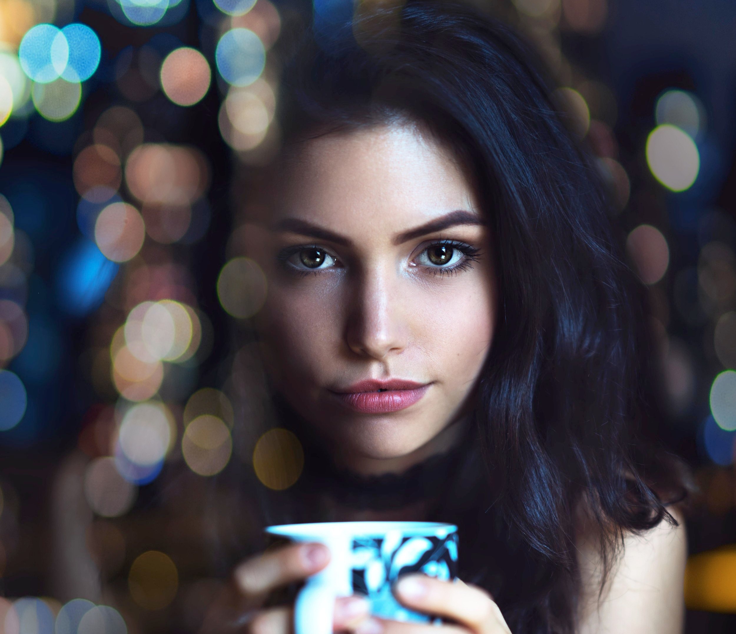 Woman holding a mug with bokeh lights HD Wallpaper
