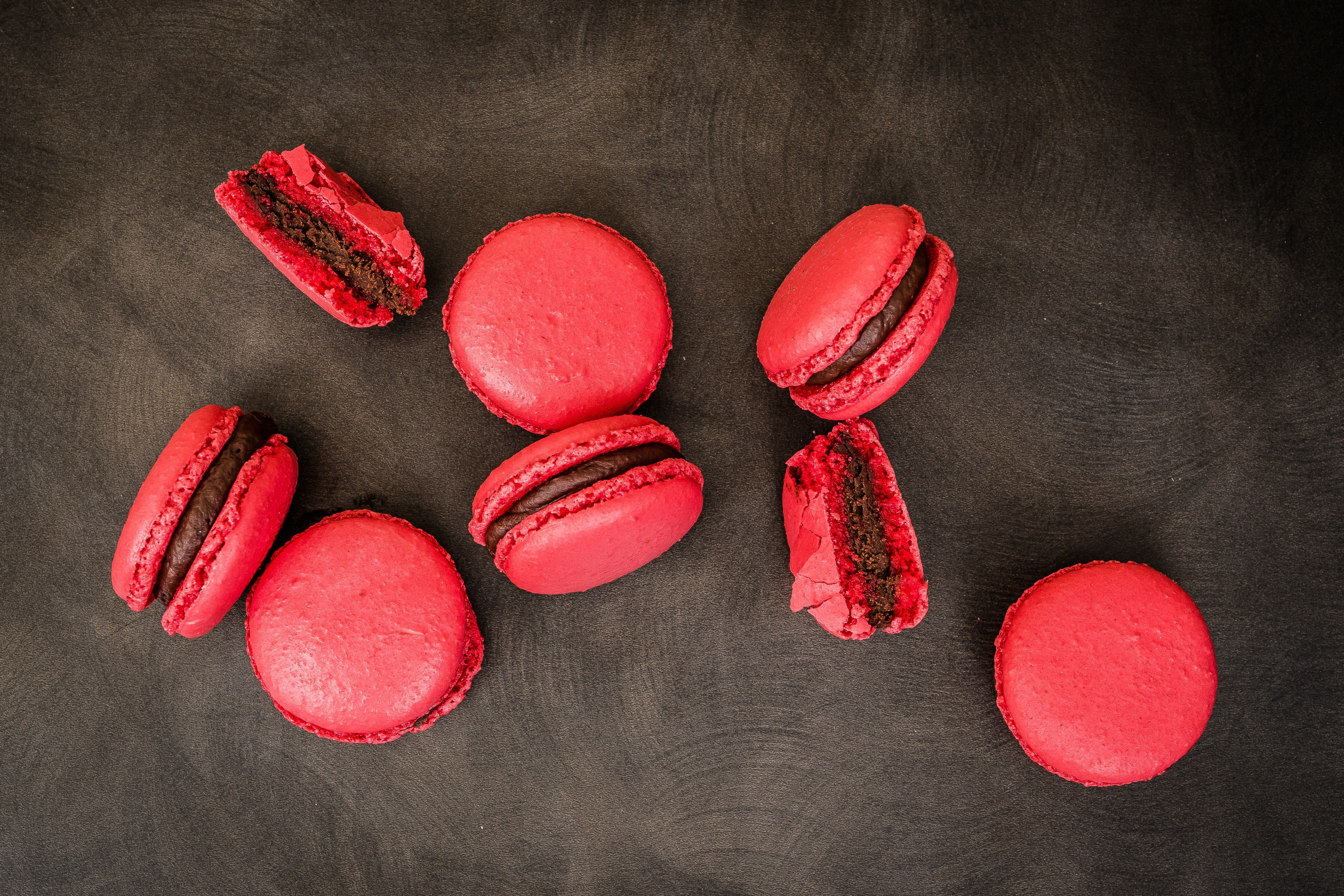 Red Macarons with Chocolate Filling 4K HD Wallpaper