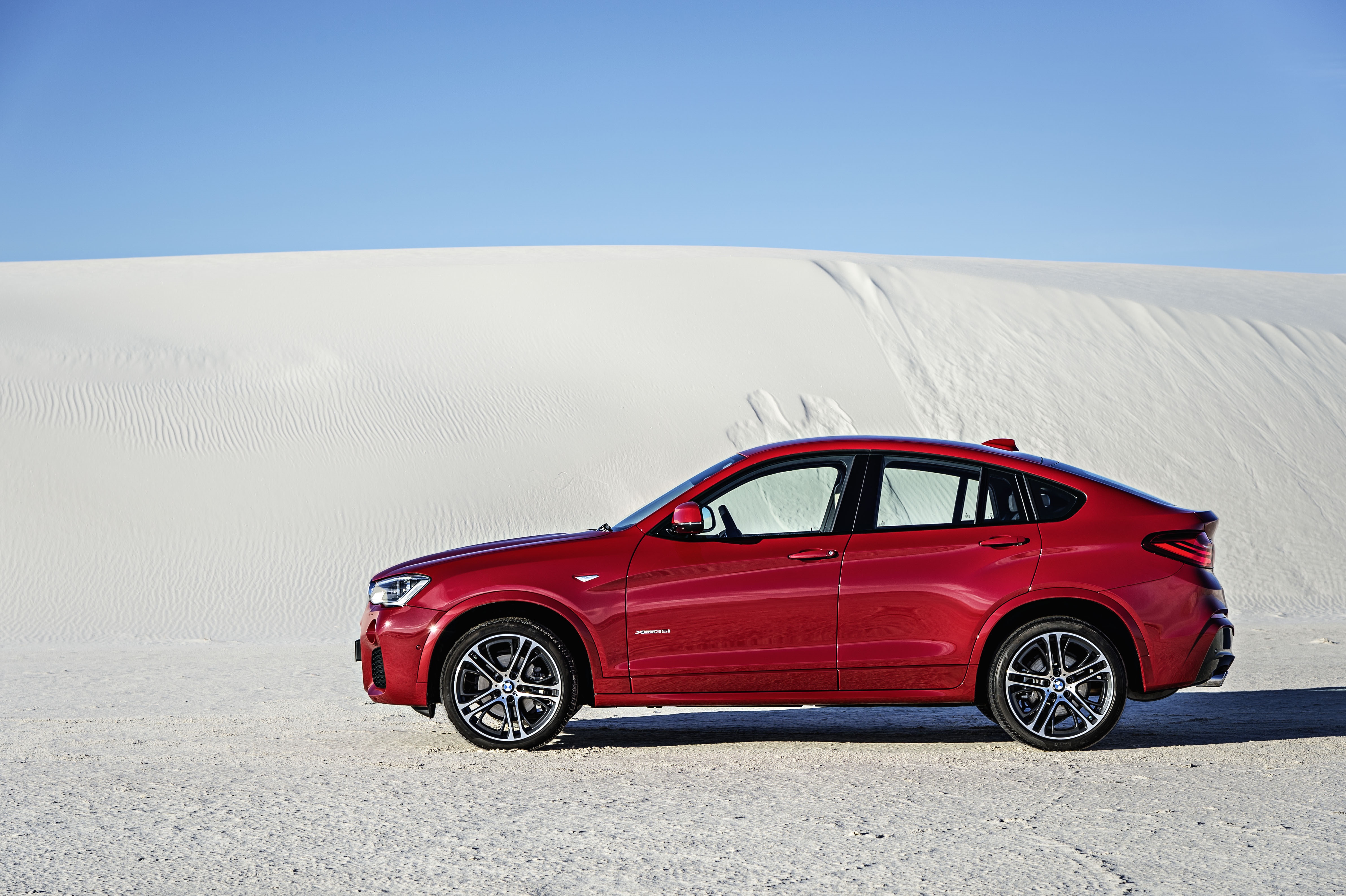 Red BMW X4 xDrive35i in a desert landscape HD Wallpaper