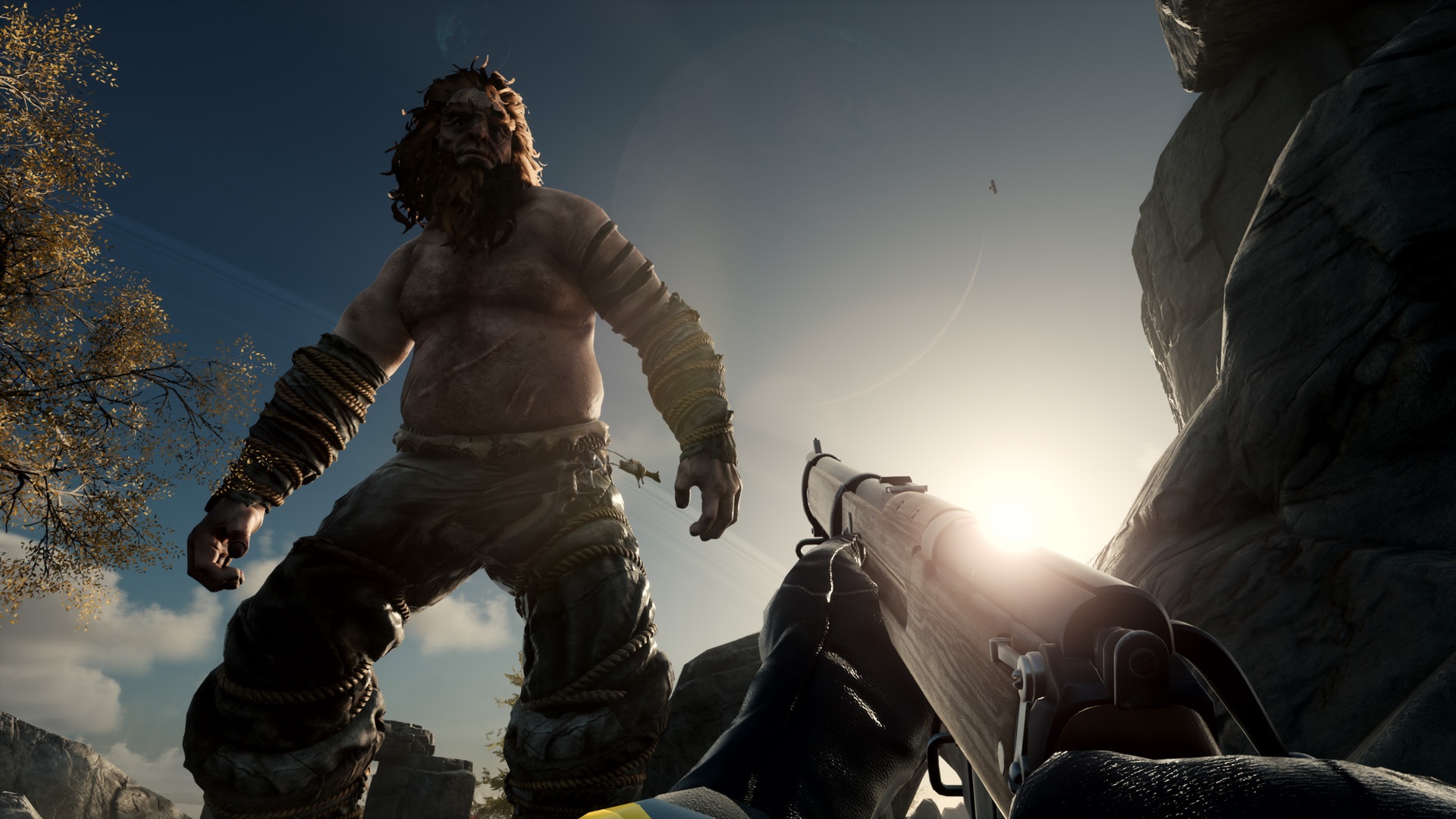 Giant enemy and player with rifle in a rocky landscape HD Wallpaper