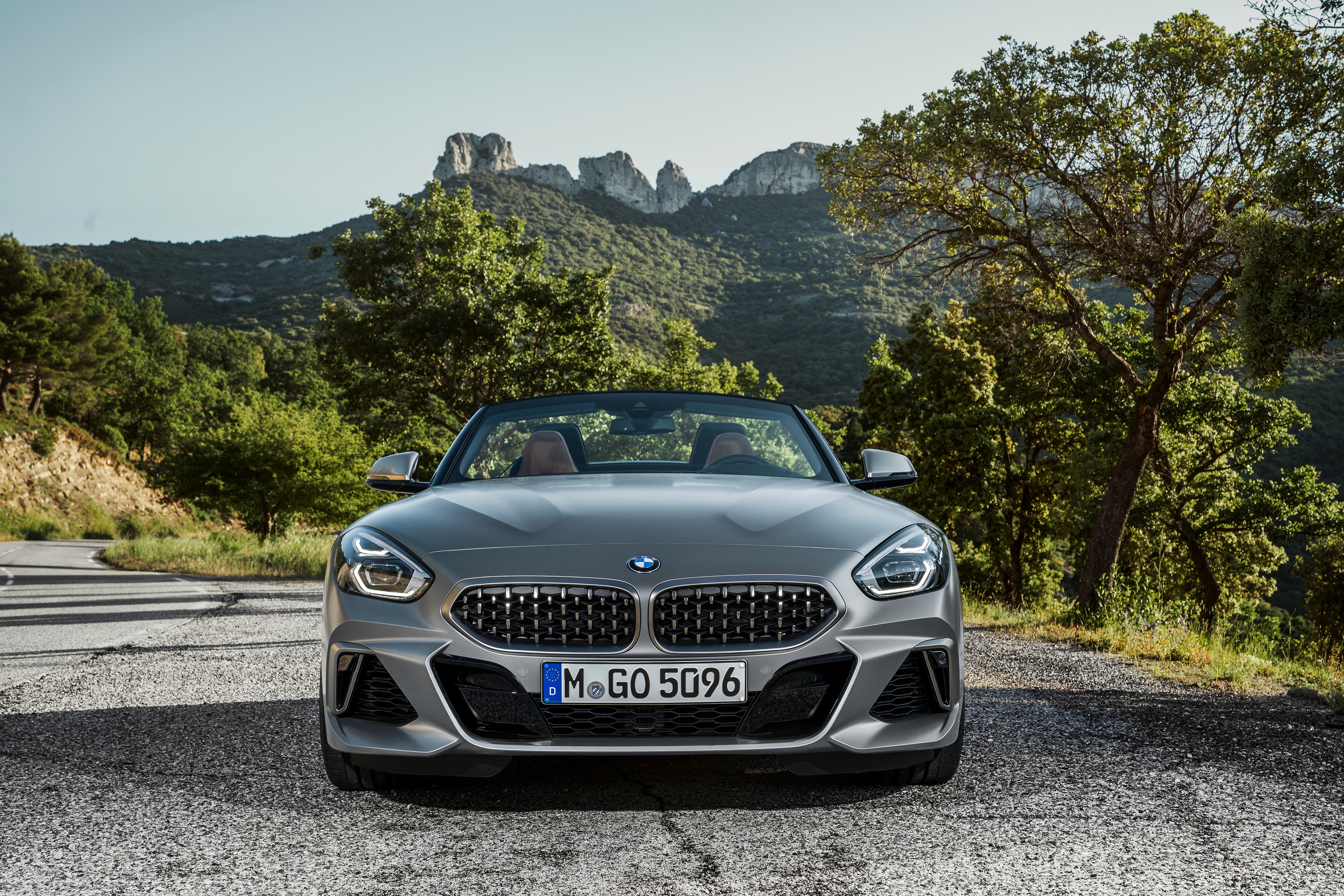 BMW Z4 convertible on a mountain road HD Wallpaper
