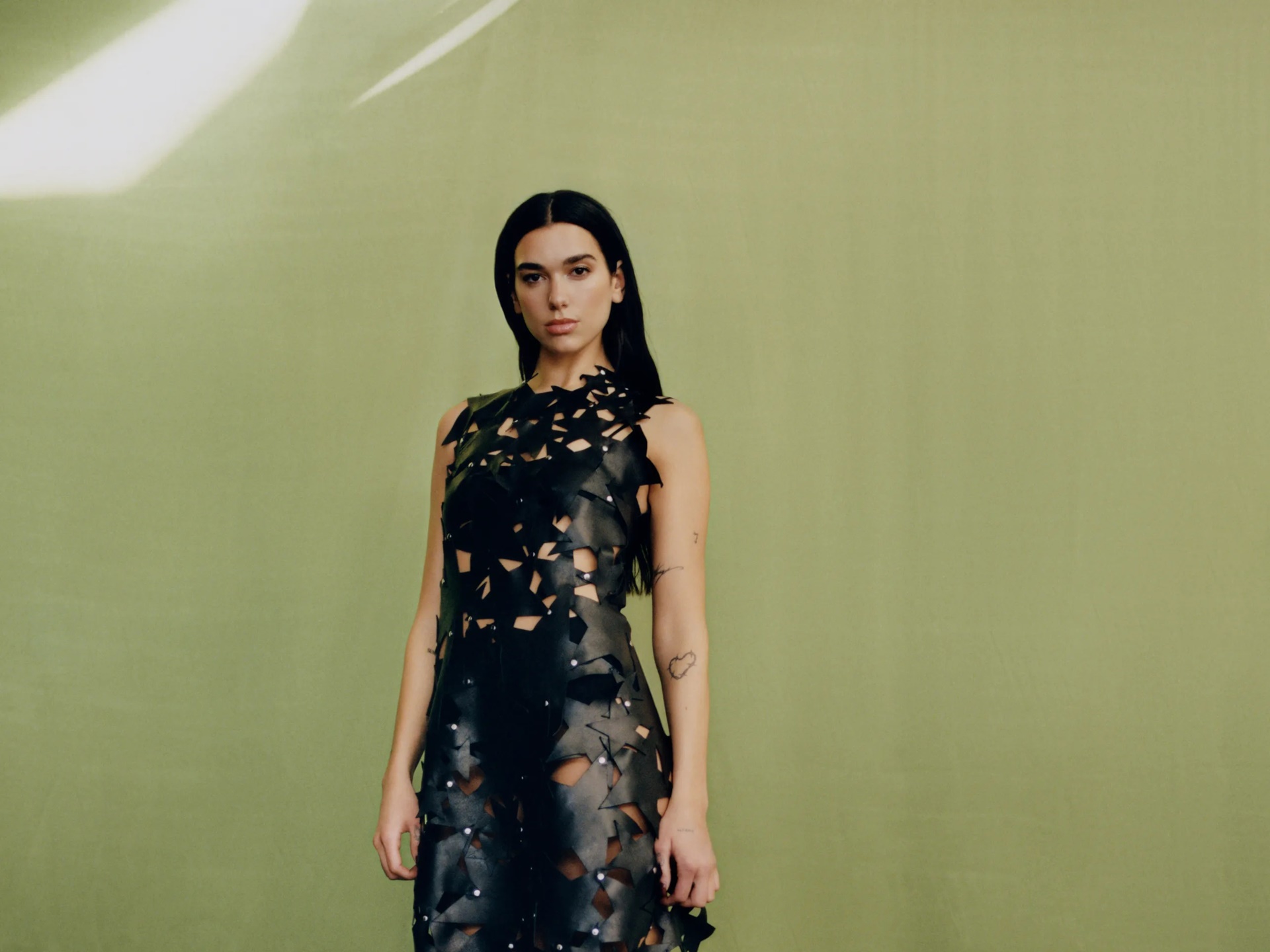 Dua Lipa in a black cutout dress HD Wallpaper