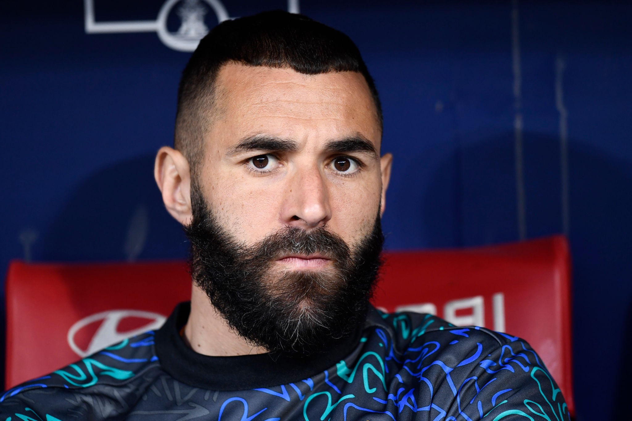 Karim Benzema sitting on a bench HD Wallpaper