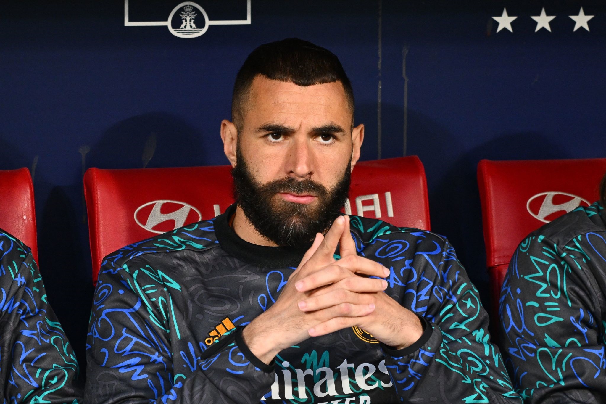 Karim Benzema sitting on a bench HD Wallpaper