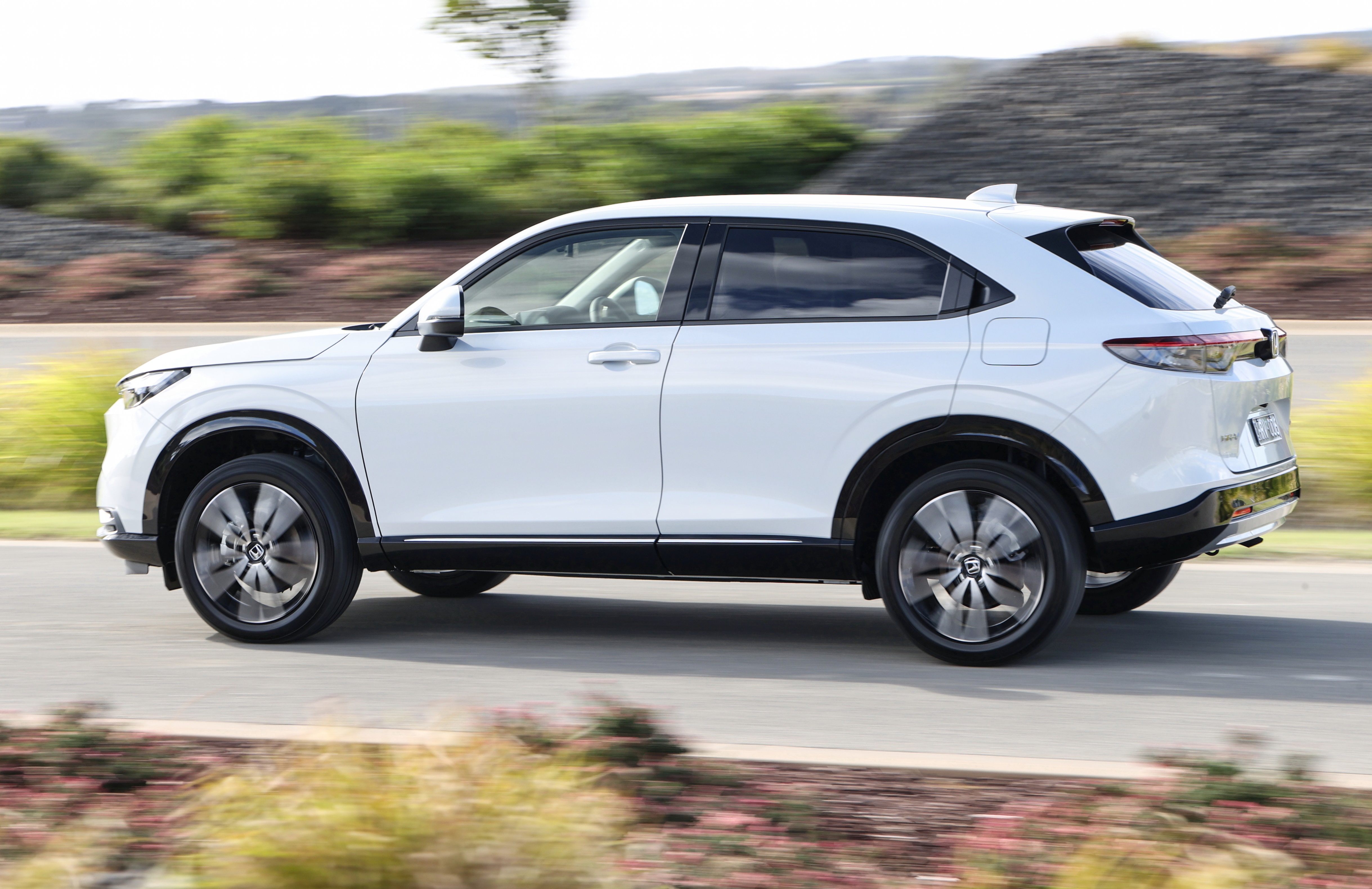 White Honda HR-V driving on a road HD Wallpaper