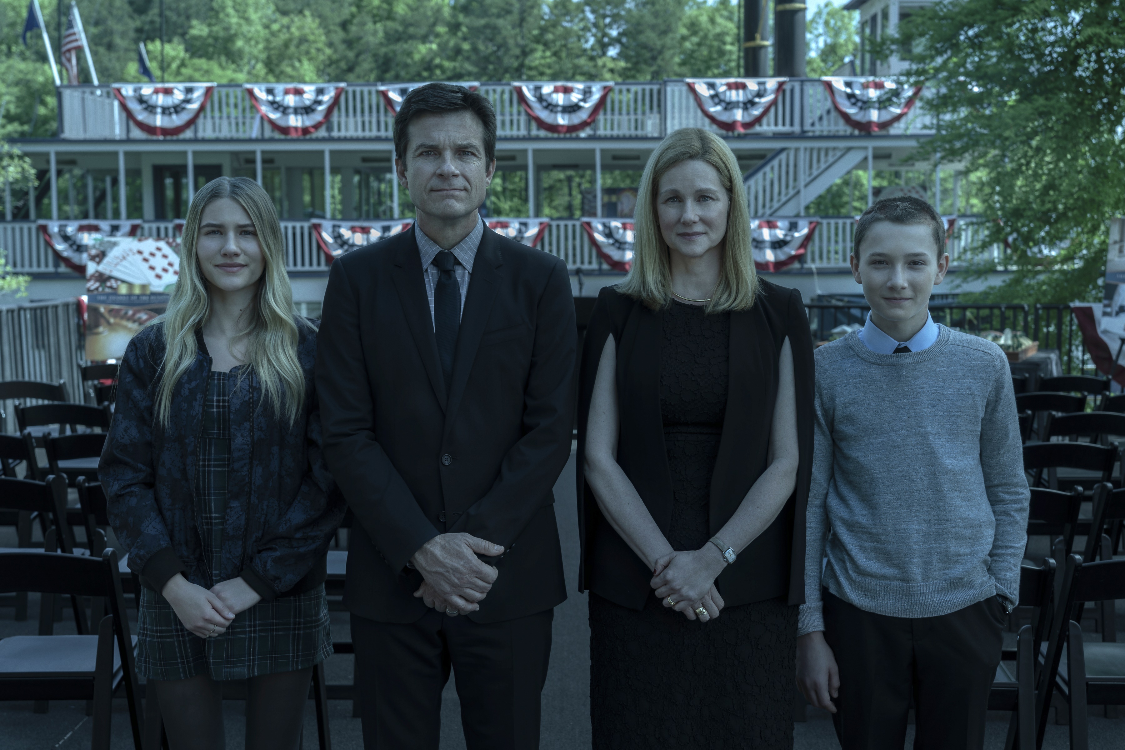 Ozark family standing in front of a boat HD Wallpaper