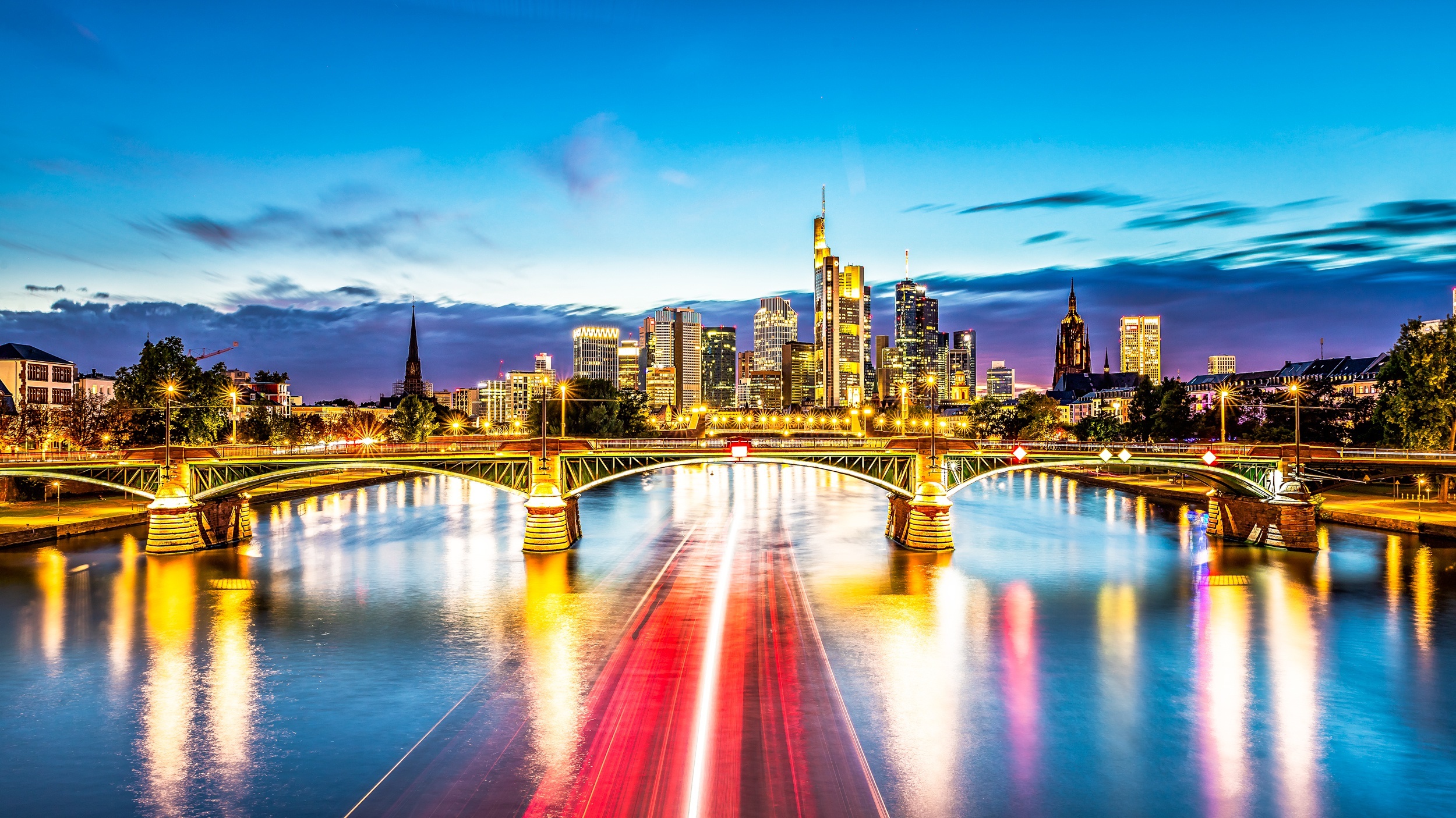 Frankfurt skyline and bridge over river at dusk HD Wallpaper