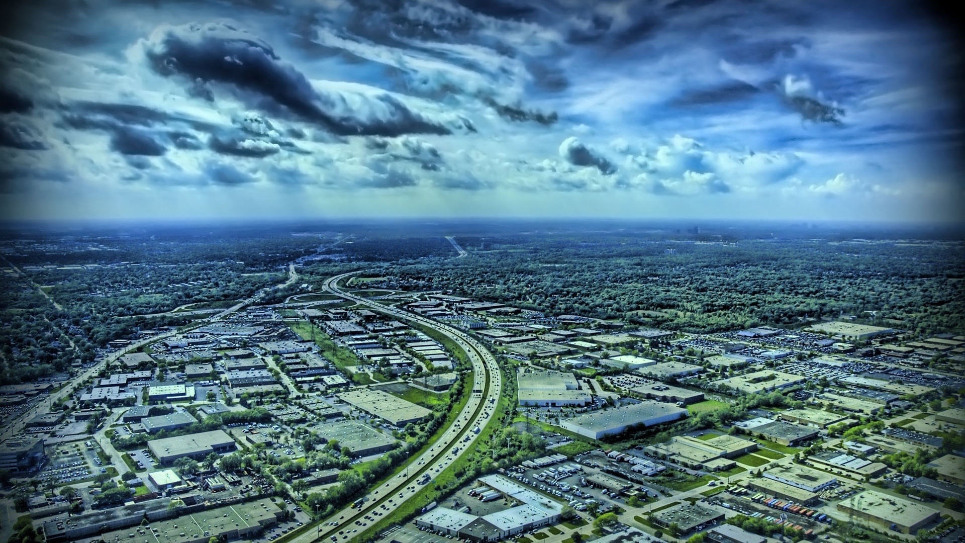 Aerial view of a highway and industrial area HD Wallpaper