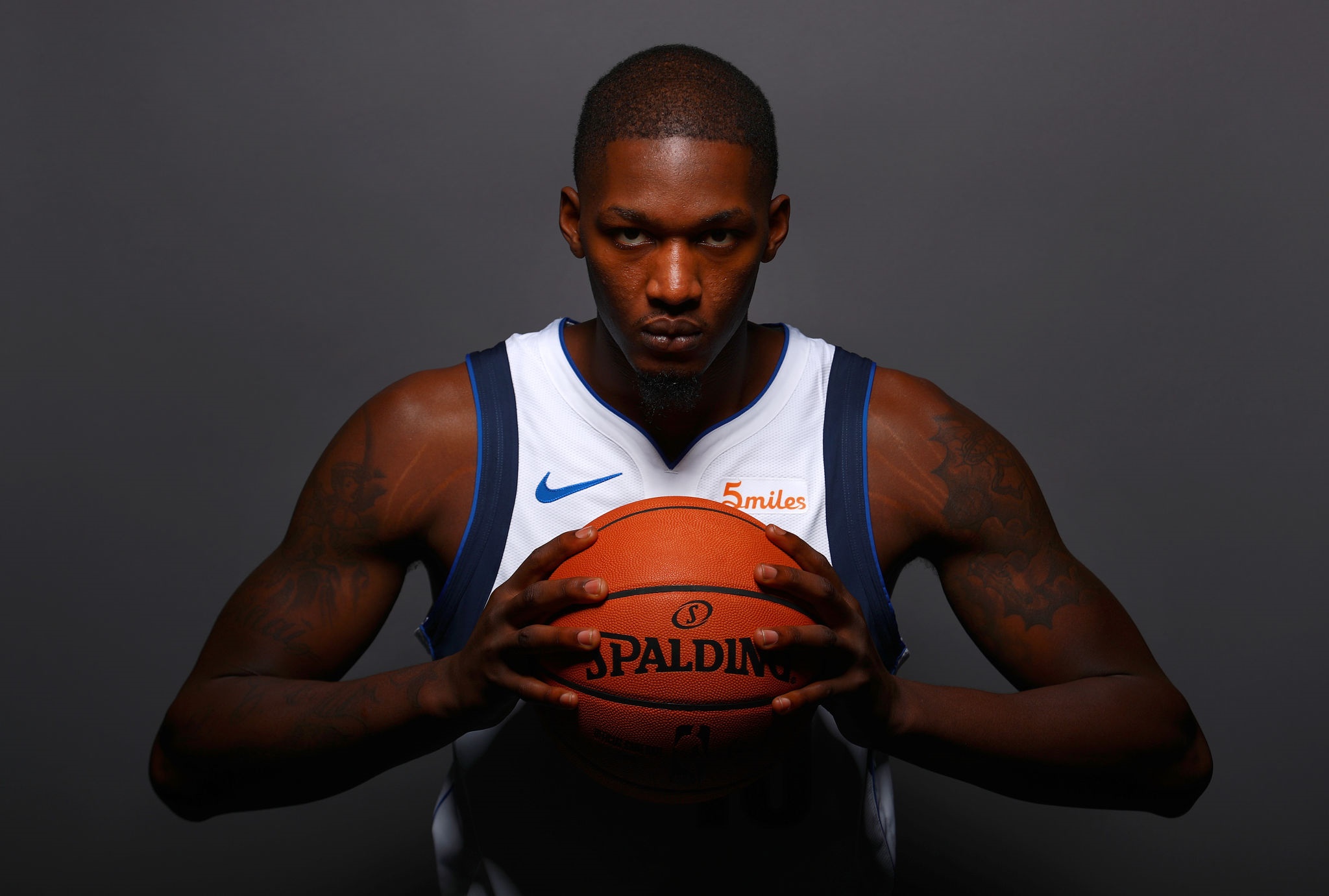 Dorian Finney-Smith holding Spalding basketball HD Wallpaper