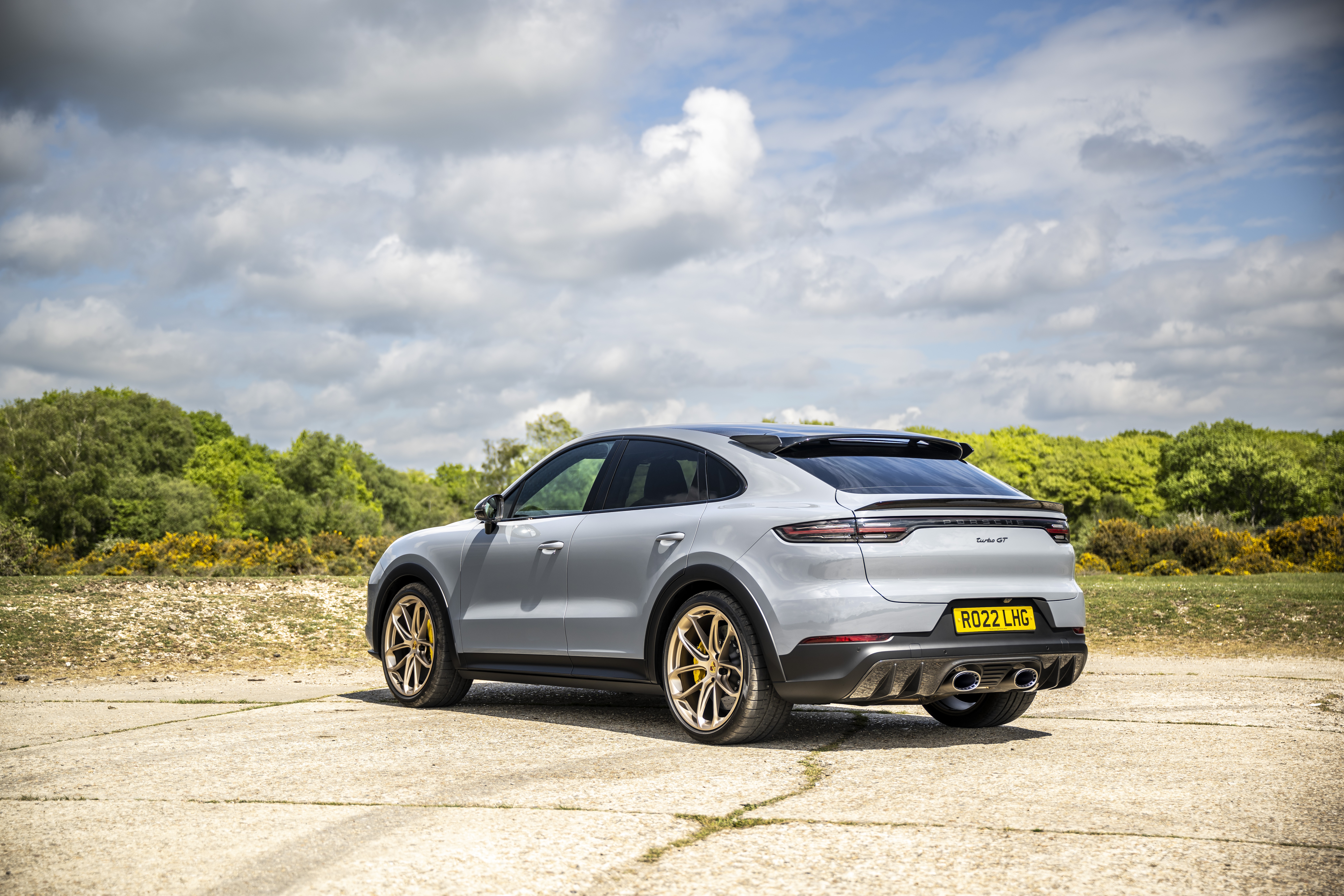 Porsche Cayenne Turbo Coupe on a dirt road HD Wallpaper