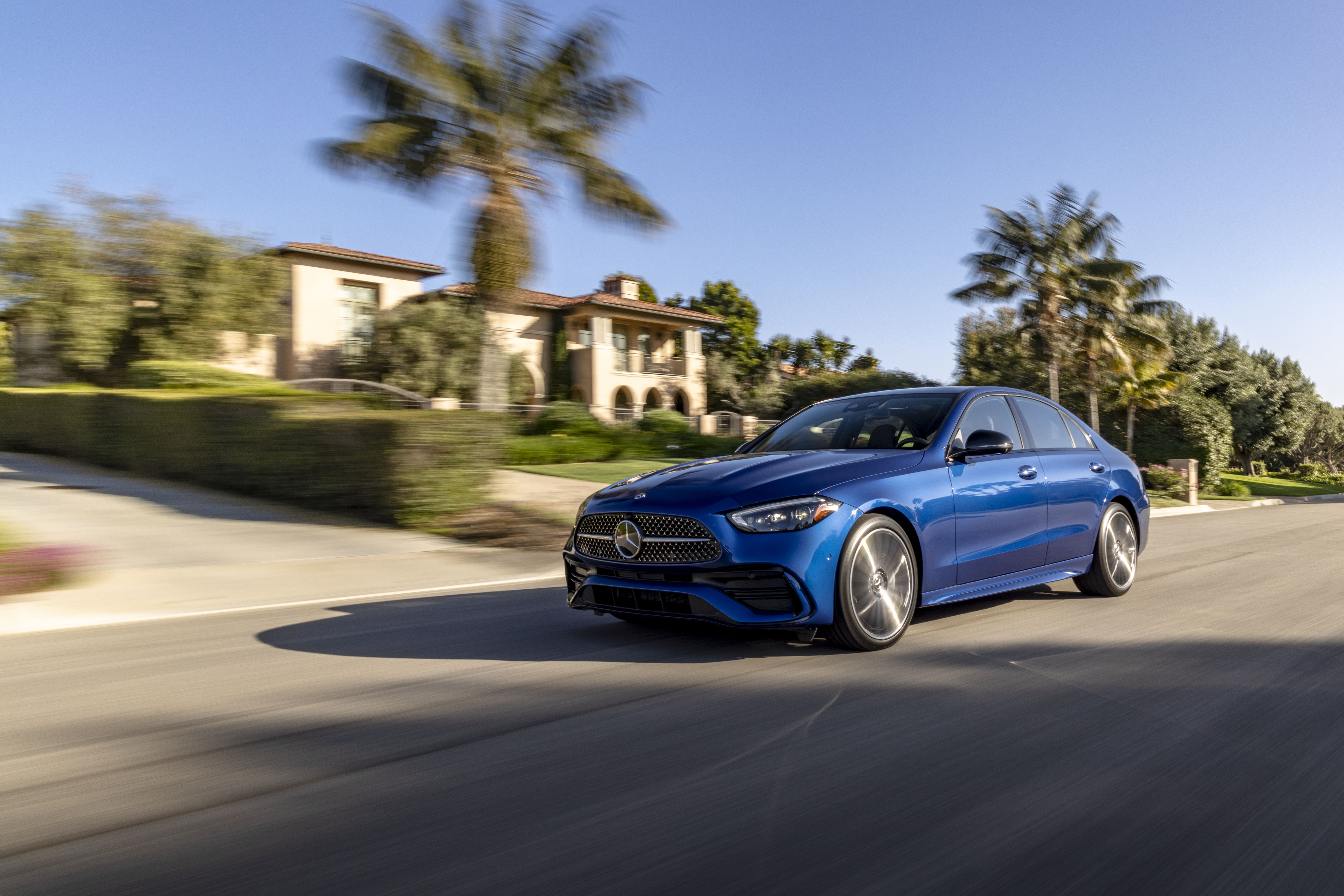 Blue Mercedes-Benz C 300 4K driving on a suburban street HD Wallpaper