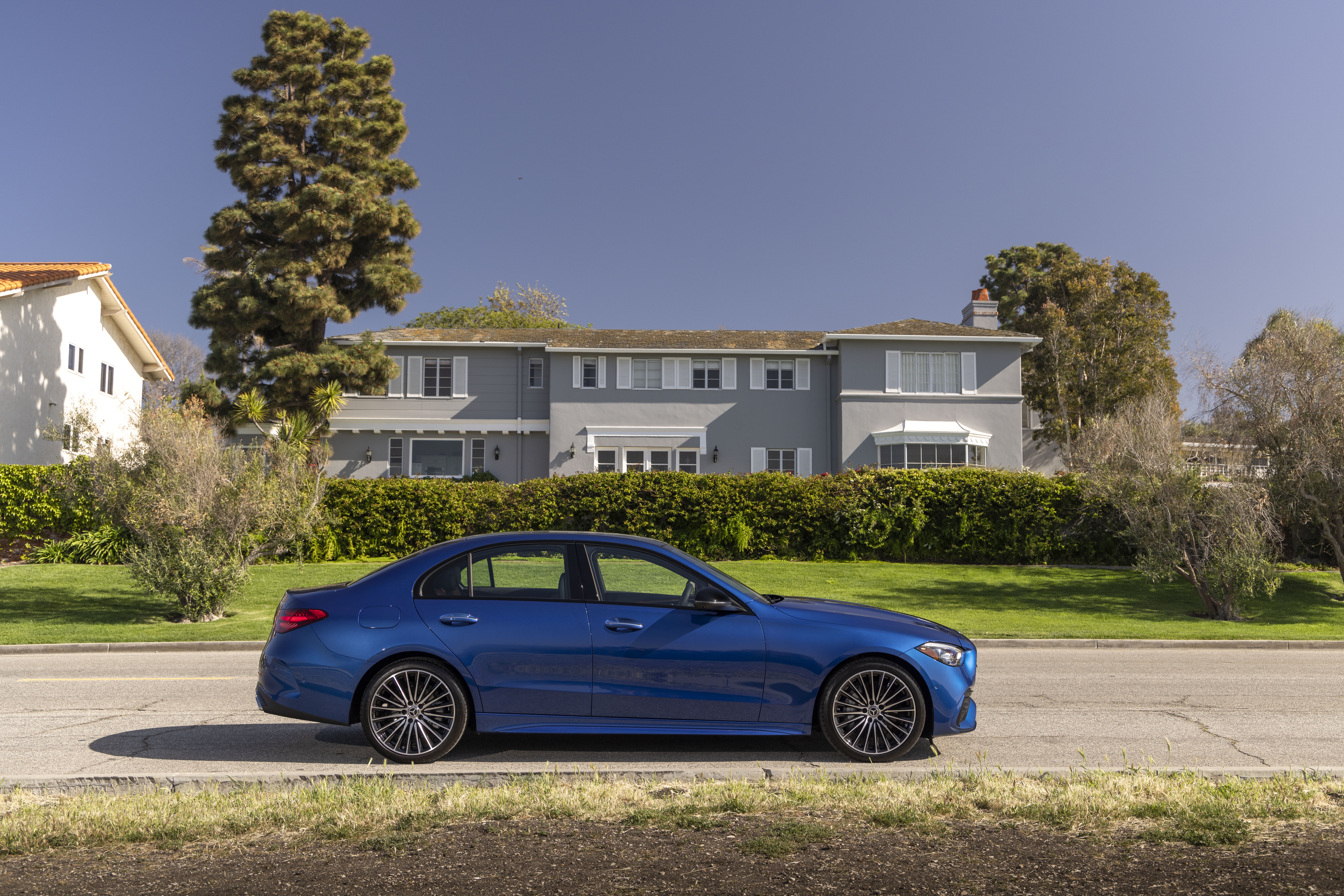 Blue Mercedes-Benz C 300 parked on a street HD Wallpaper