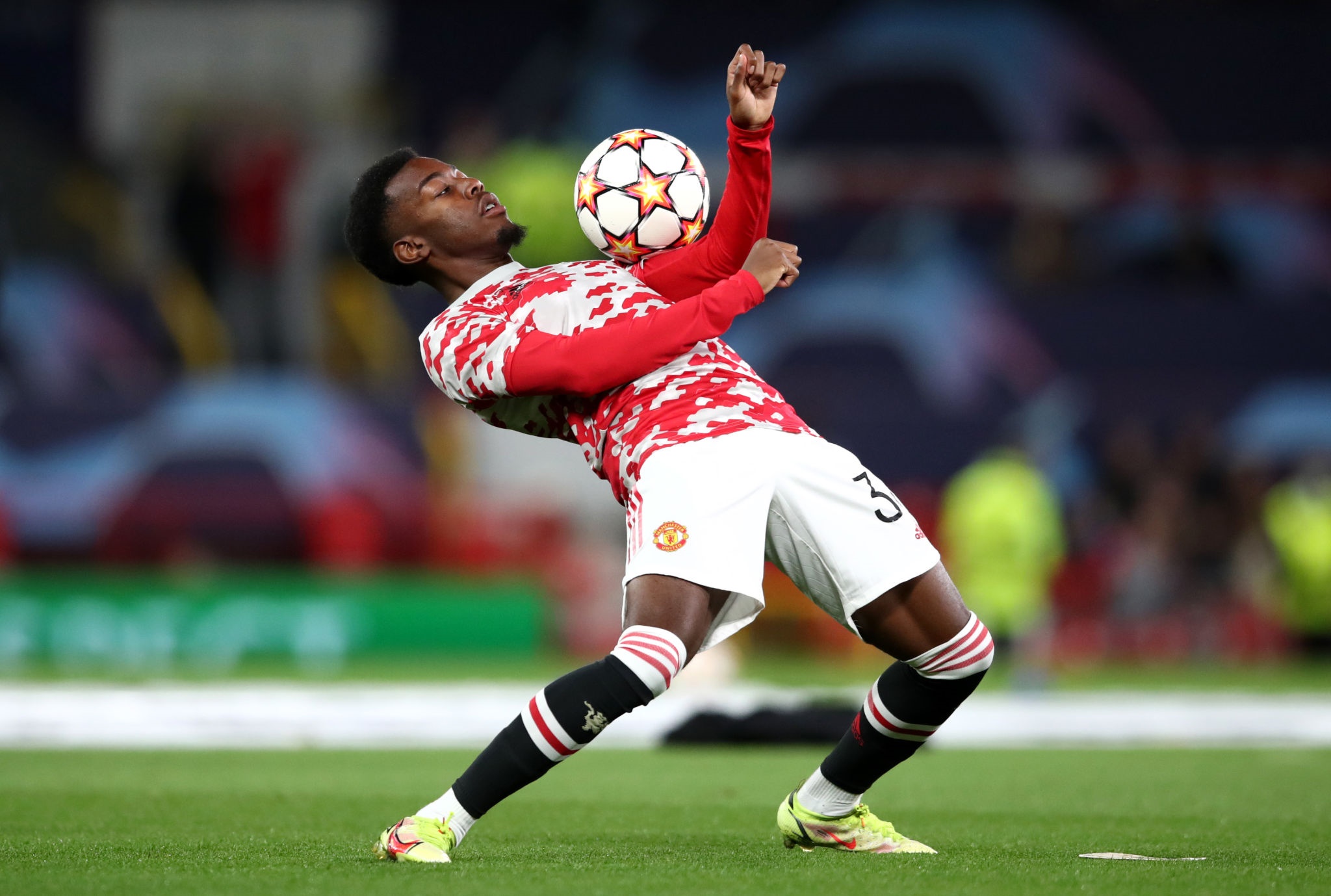 Anthony Elanga of Manchester United juggling a soccer ball HD Wallpaper