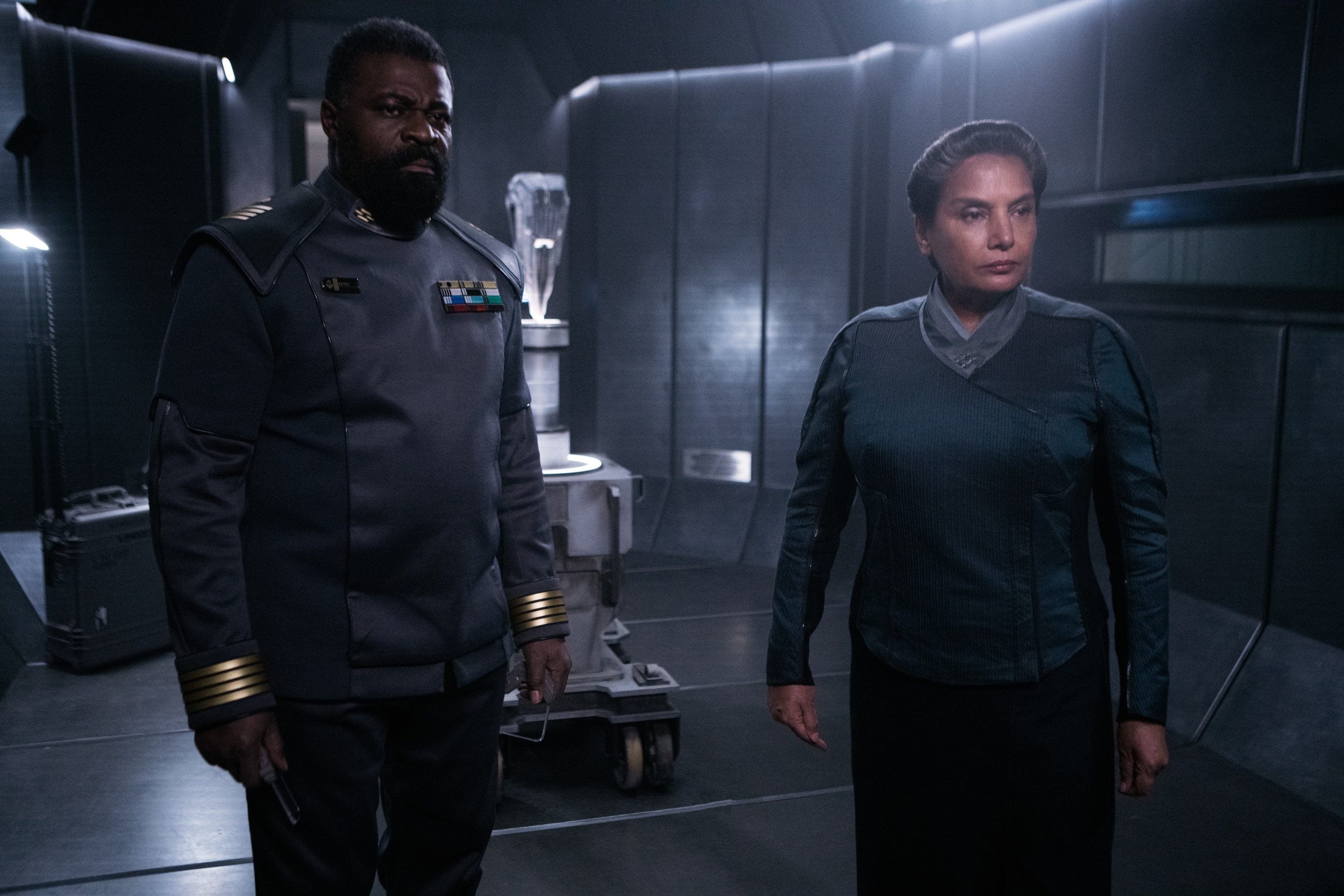 Two military officers in a spaceship interior HD Wallpaper