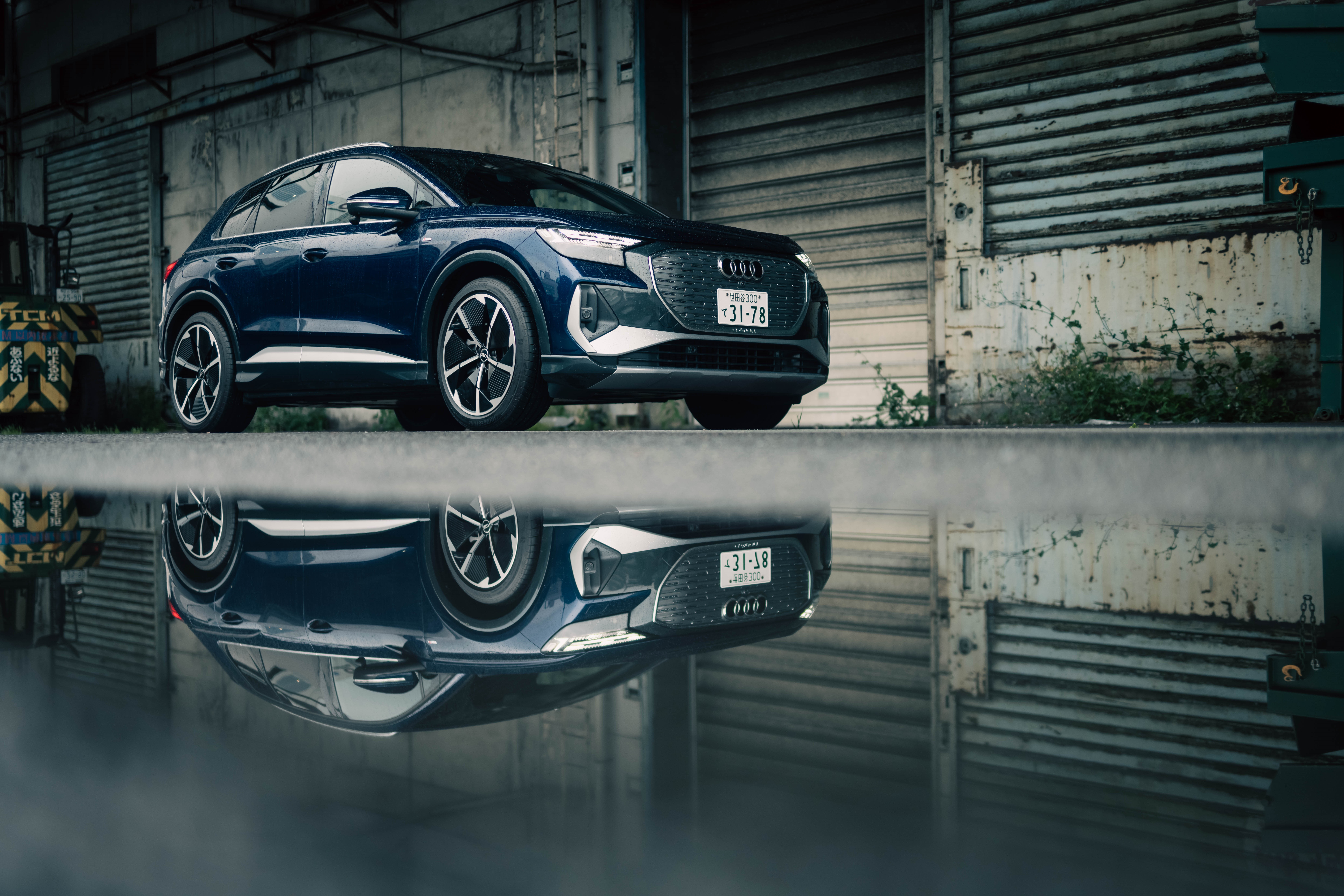 Audi Q4 E-tron reflected in water HD Wallpaper