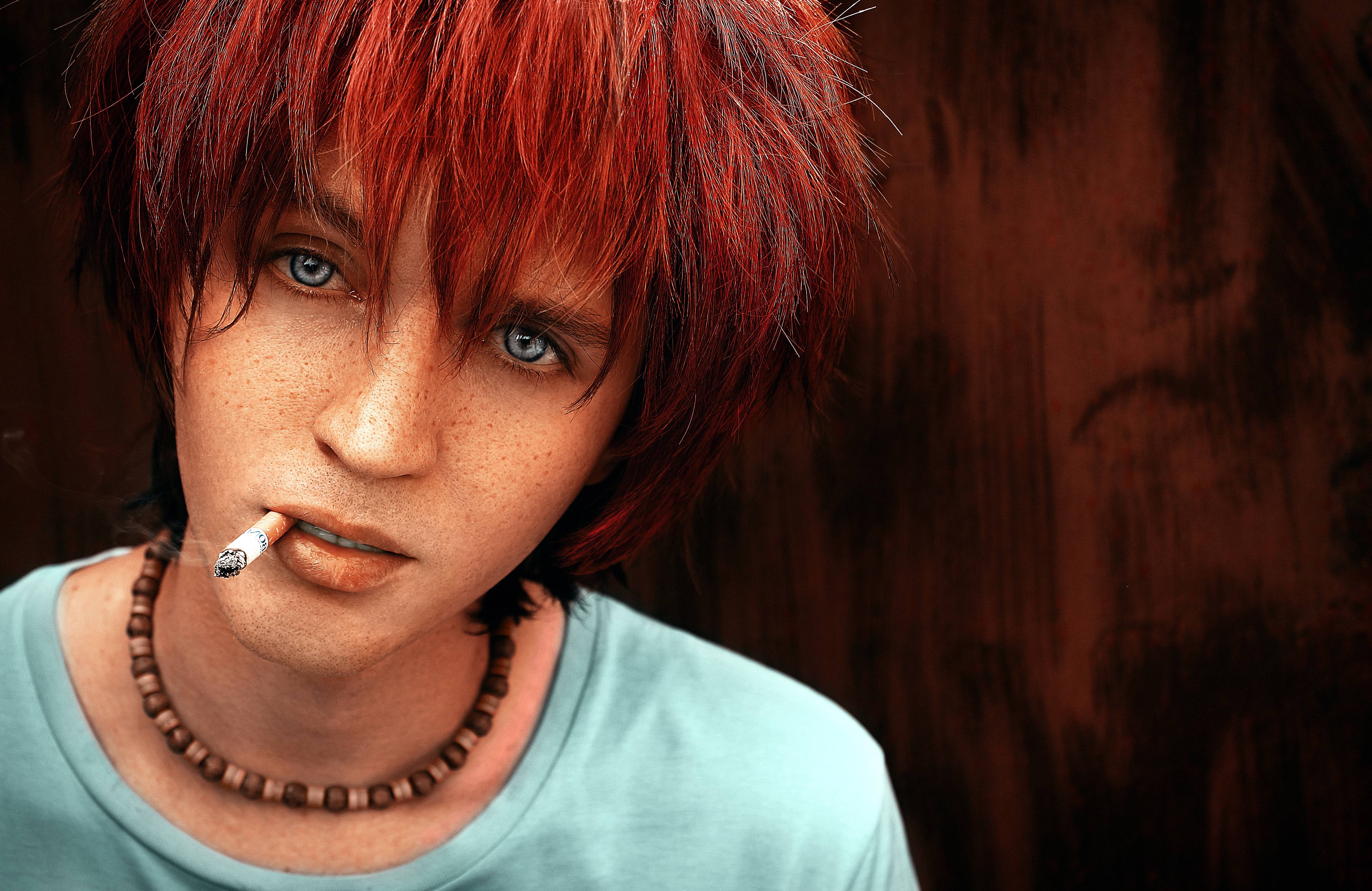 Freckled person with red hair smoking HD Wallpaper