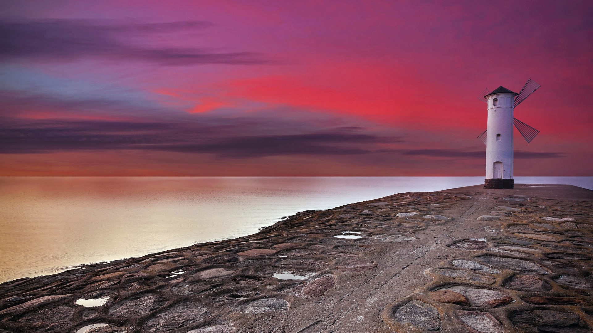Stawa Młyny lighthouse in Świnoujście, Poland at sunset HD Wallpaper
