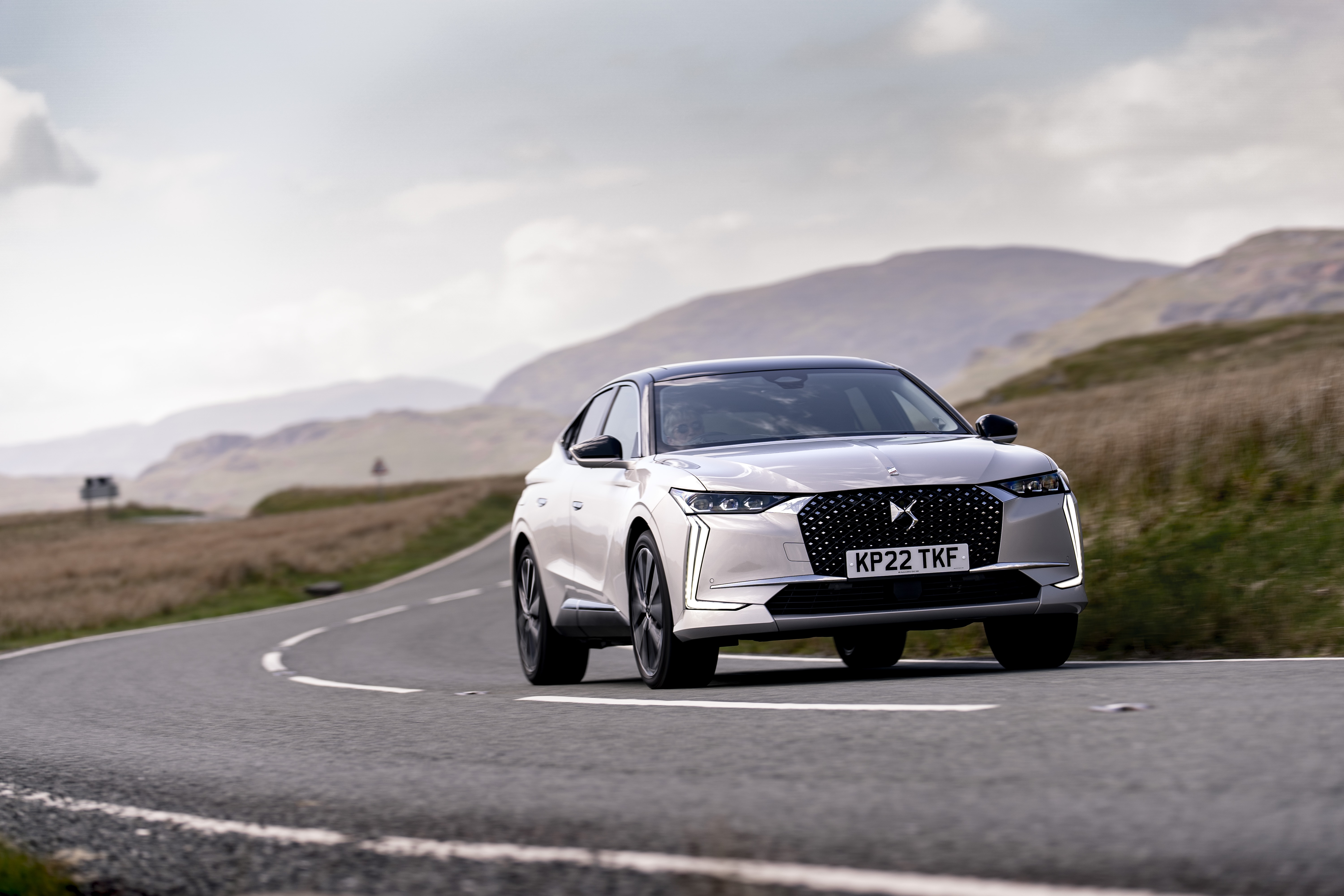 DS 4 E-Tense Rivoli driving on a winding road HD Wallpaper