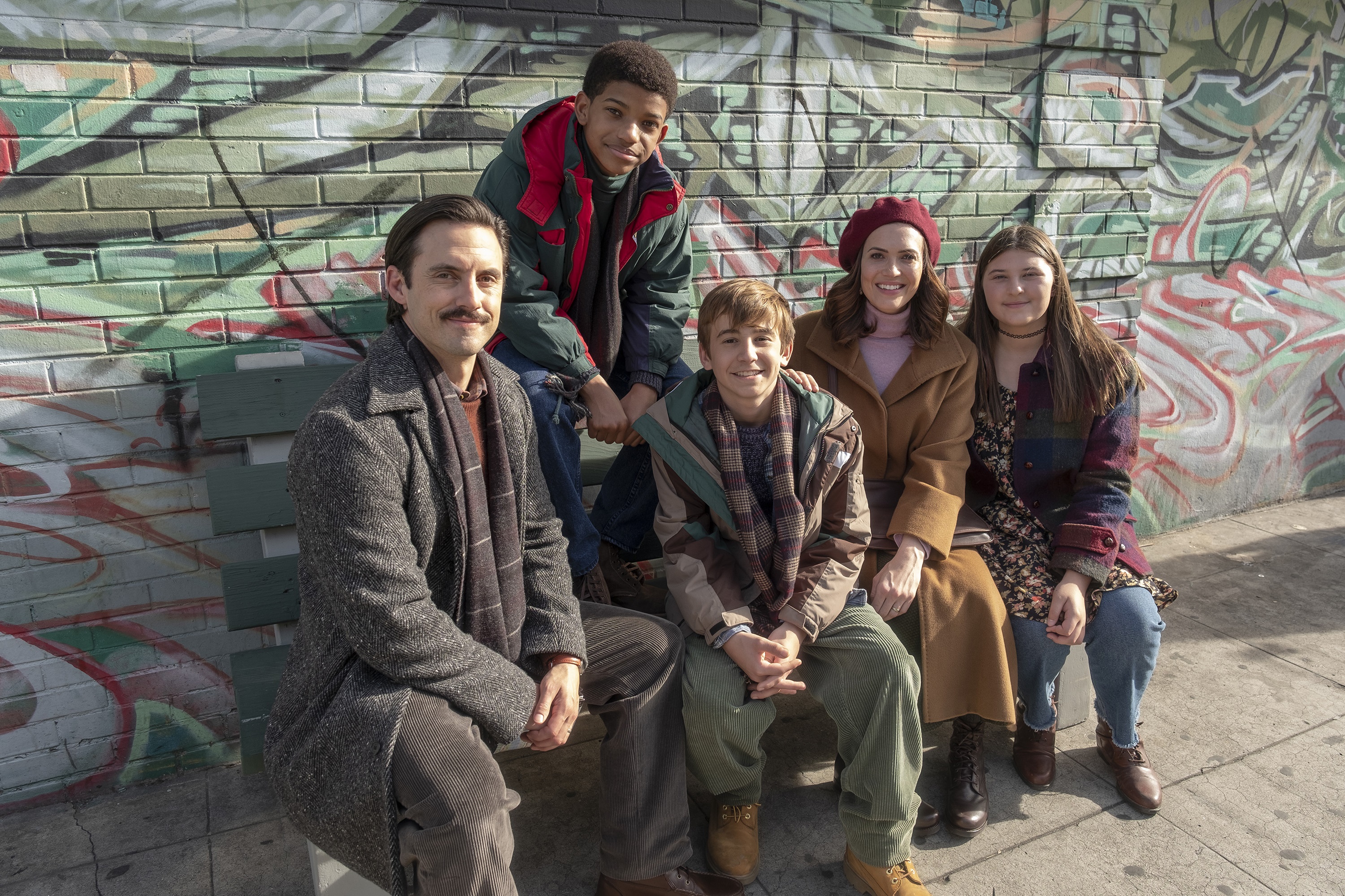 This Is Us cast posing in front of graffiti wall HD Wallpaper