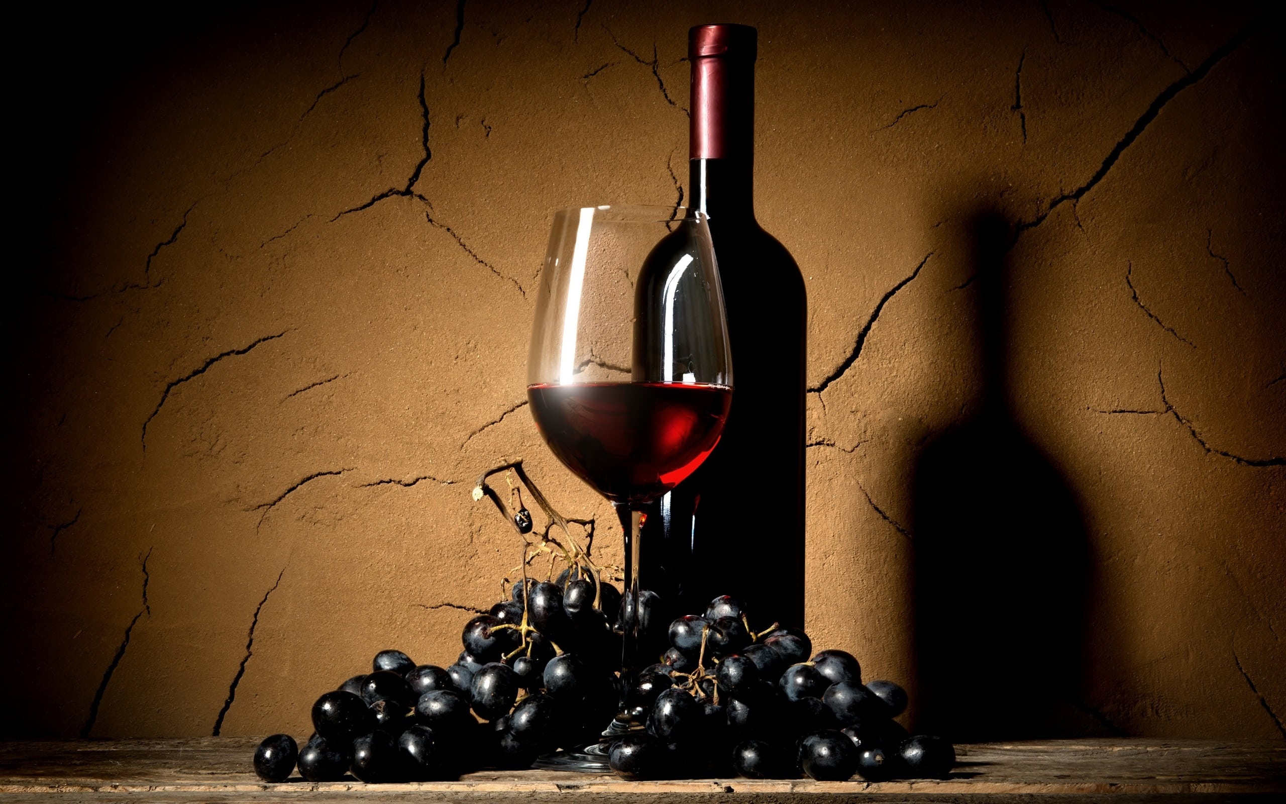 Bottle of red wine with glass and grapes HD Wallpaper