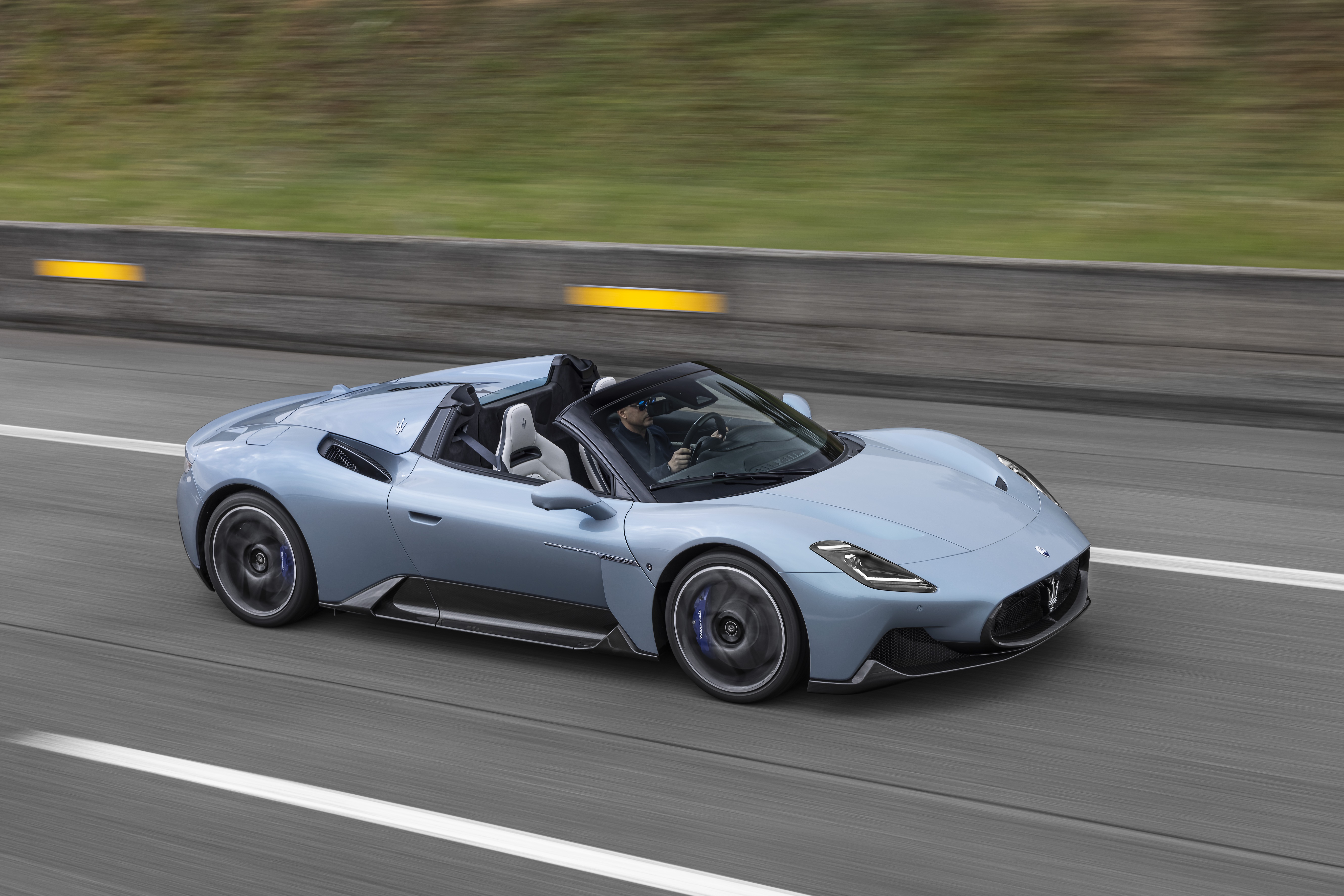Maserati MC20 Cielo convertible driving on a highway HD Wallpaper