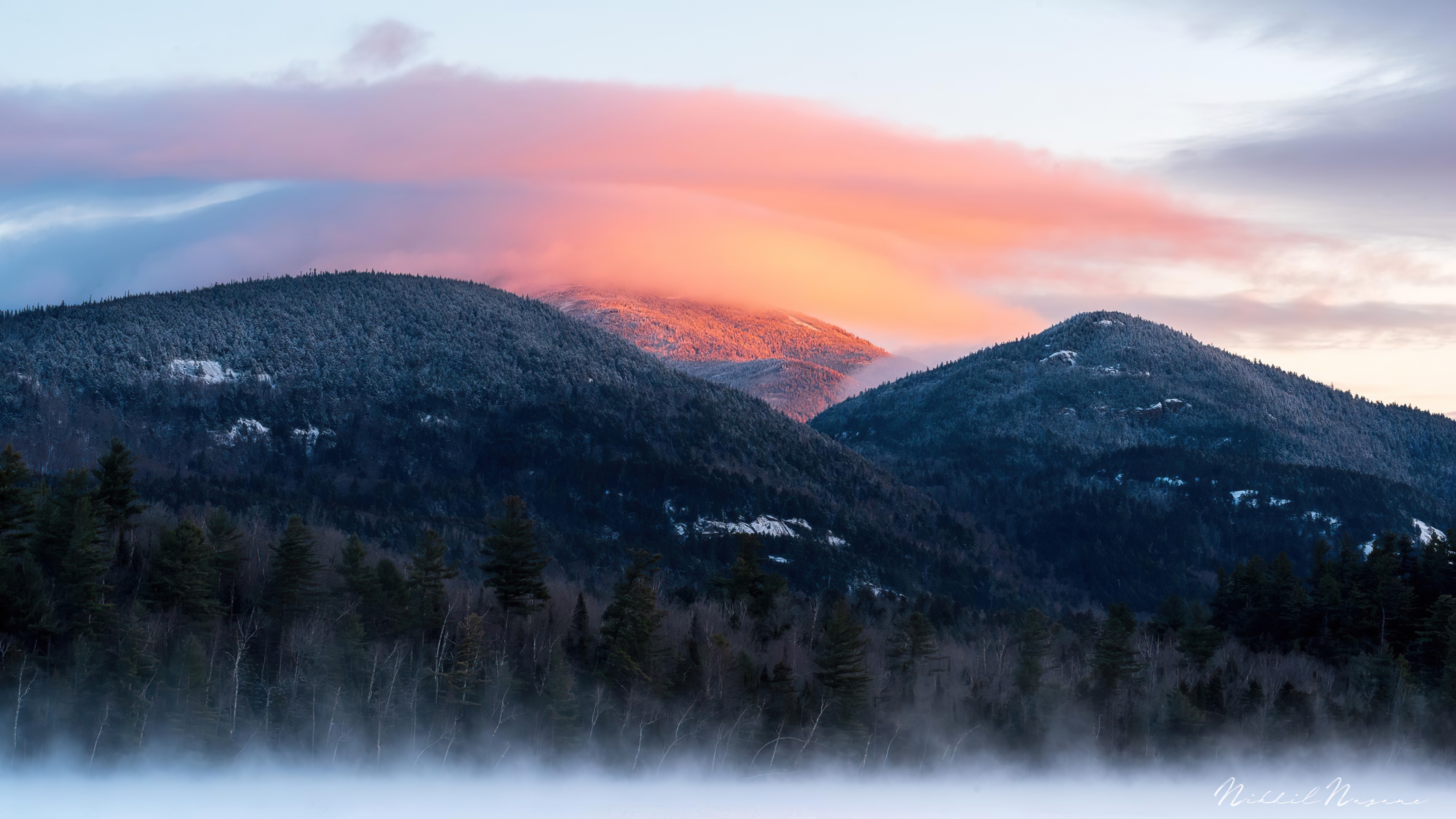 Mountains at sunrise with pink clouds and mist HD Wallpaper