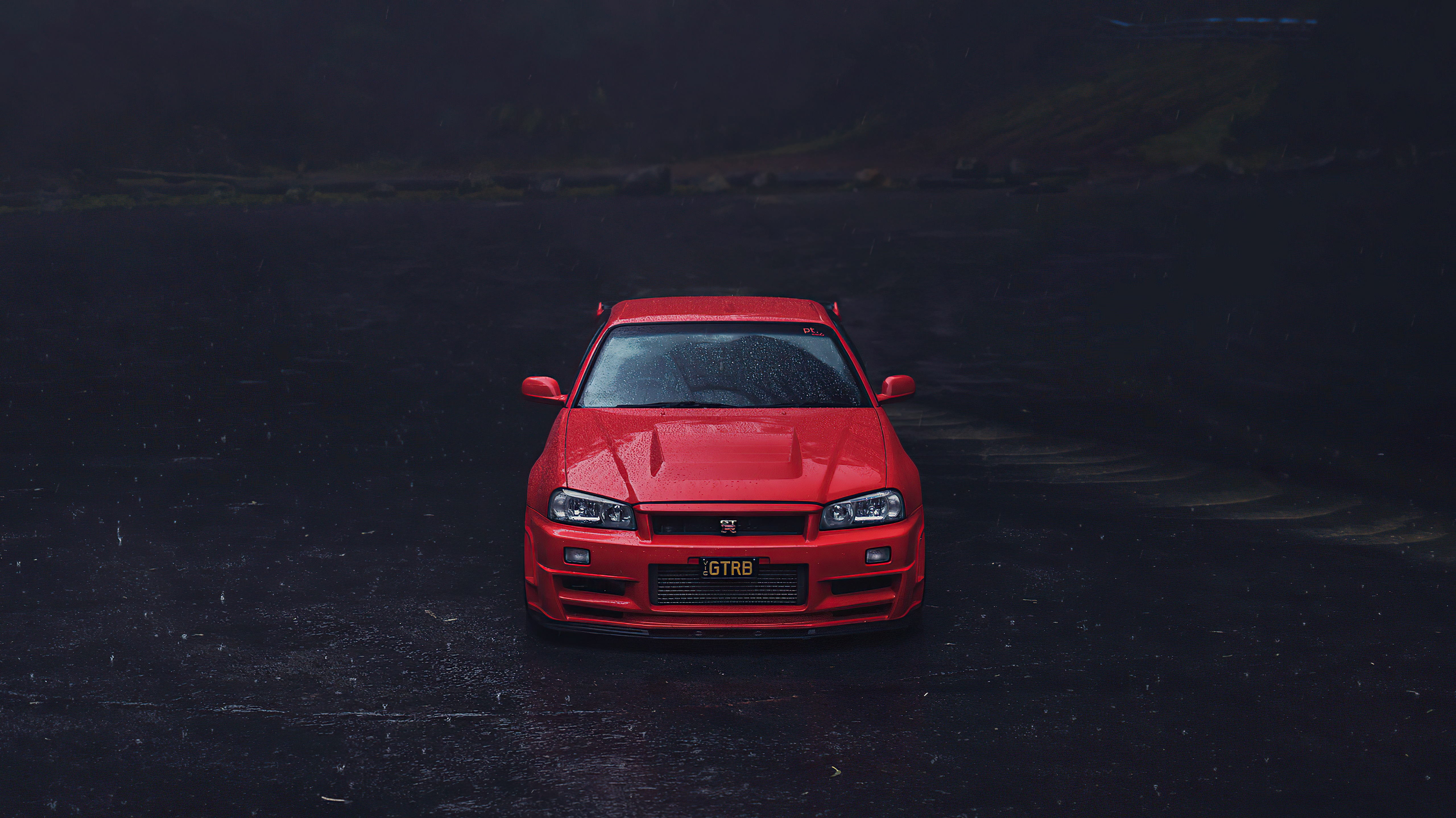 Red Nissan GT-R R34 in the rain HD Wallpaper