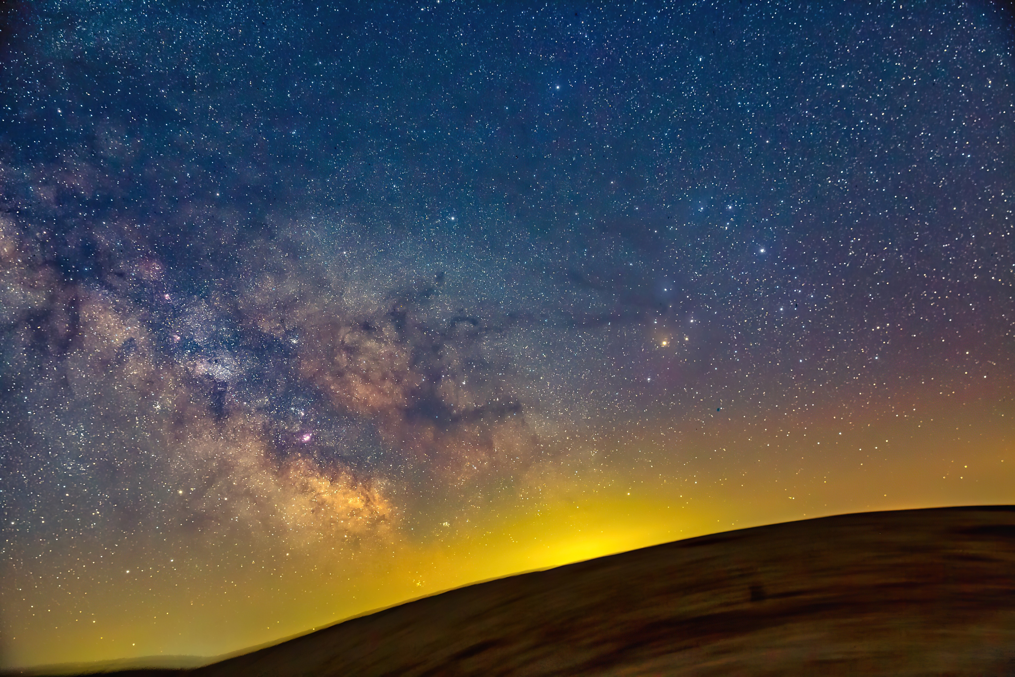 Milky Way galaxy over a dark landscape HD Wallpaper