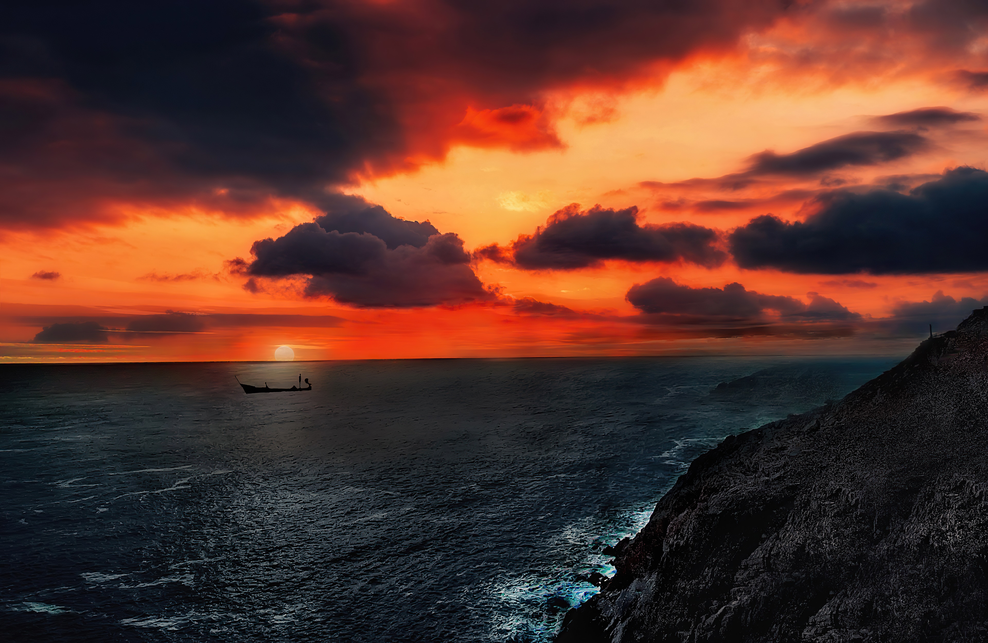 Boat on the ocean during a dramatic sunset HD Wallpaper