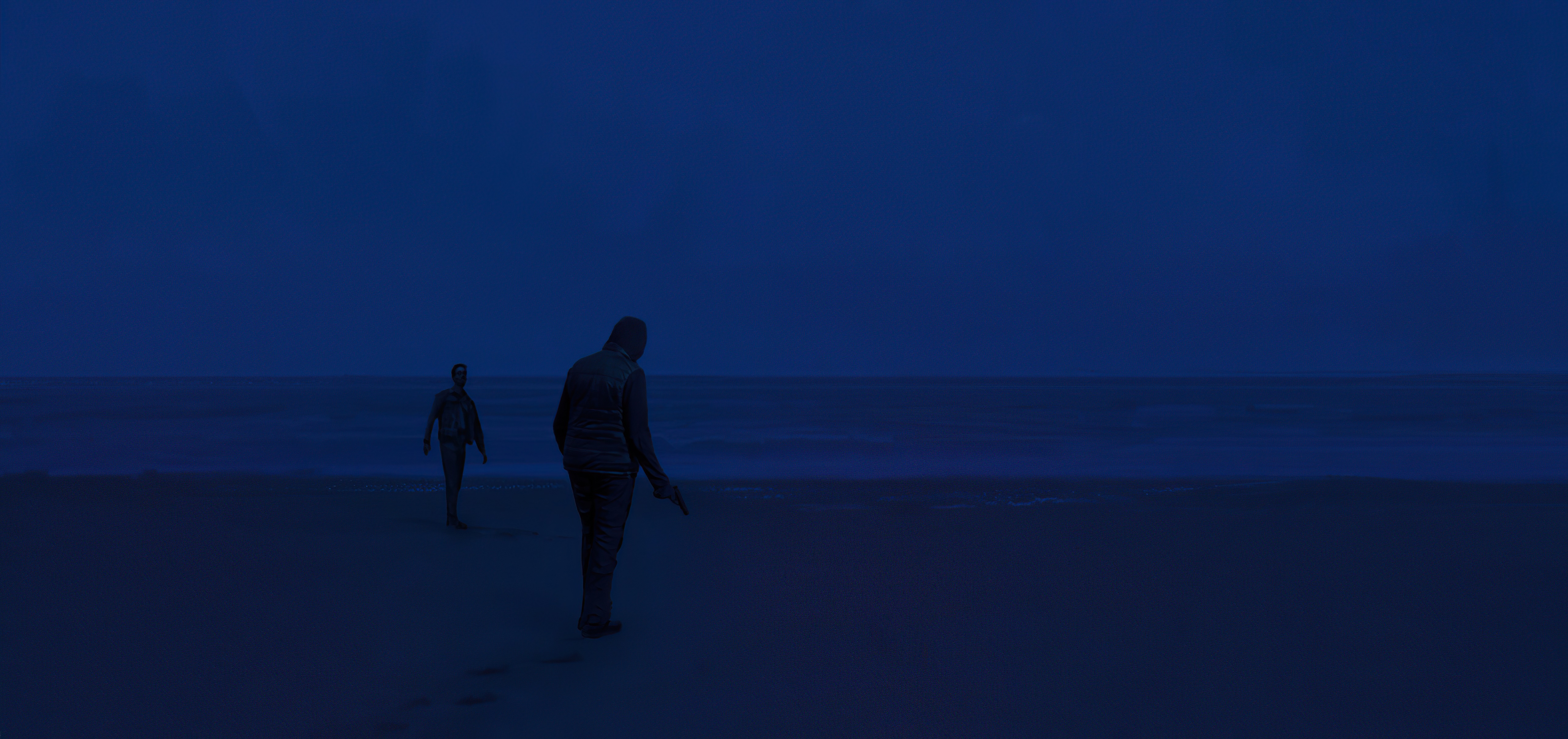 Two figures on a beach at dusk HD Wallpaper