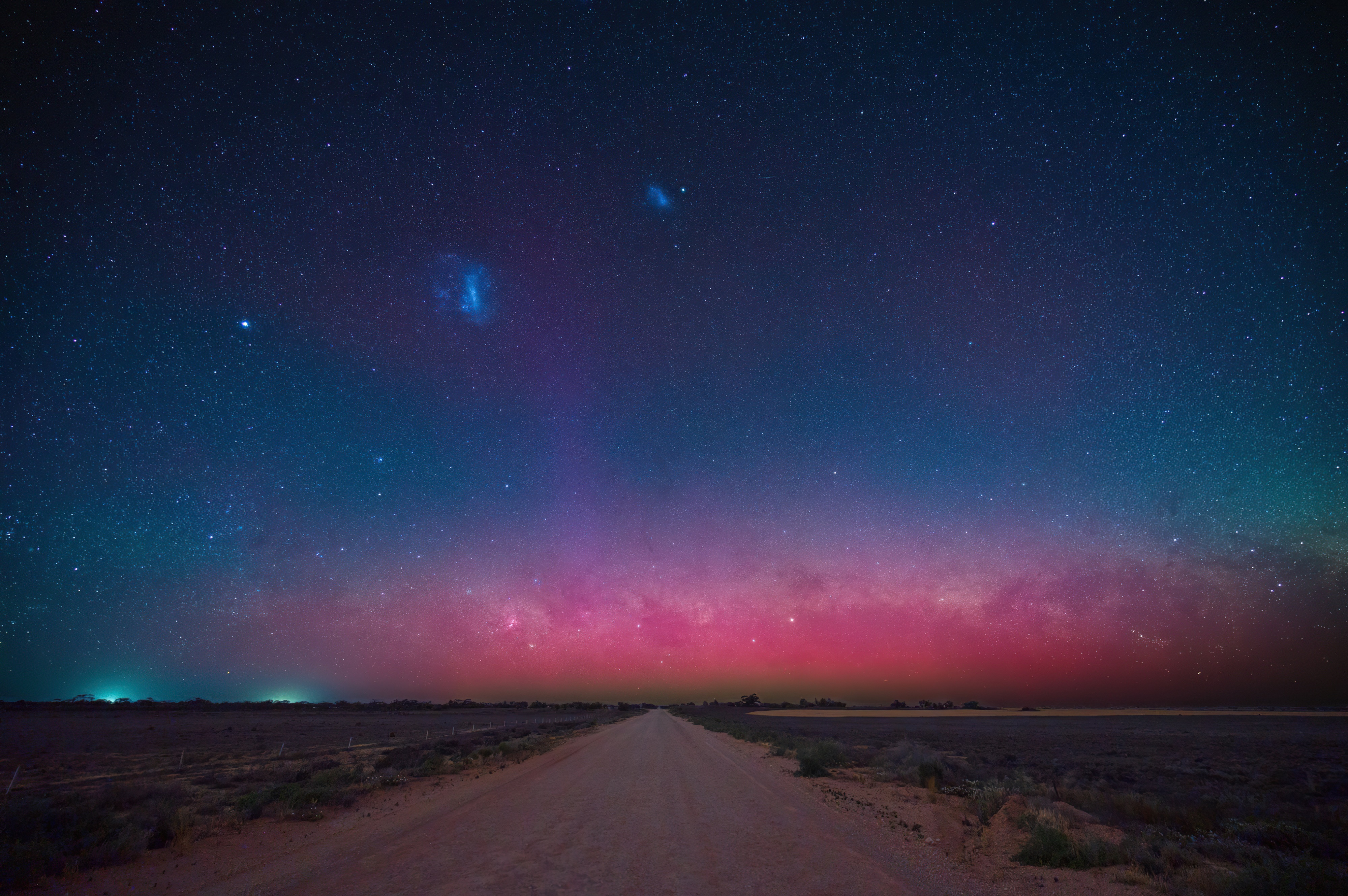 Milky Way over a dirt road at night HD Wallpaper