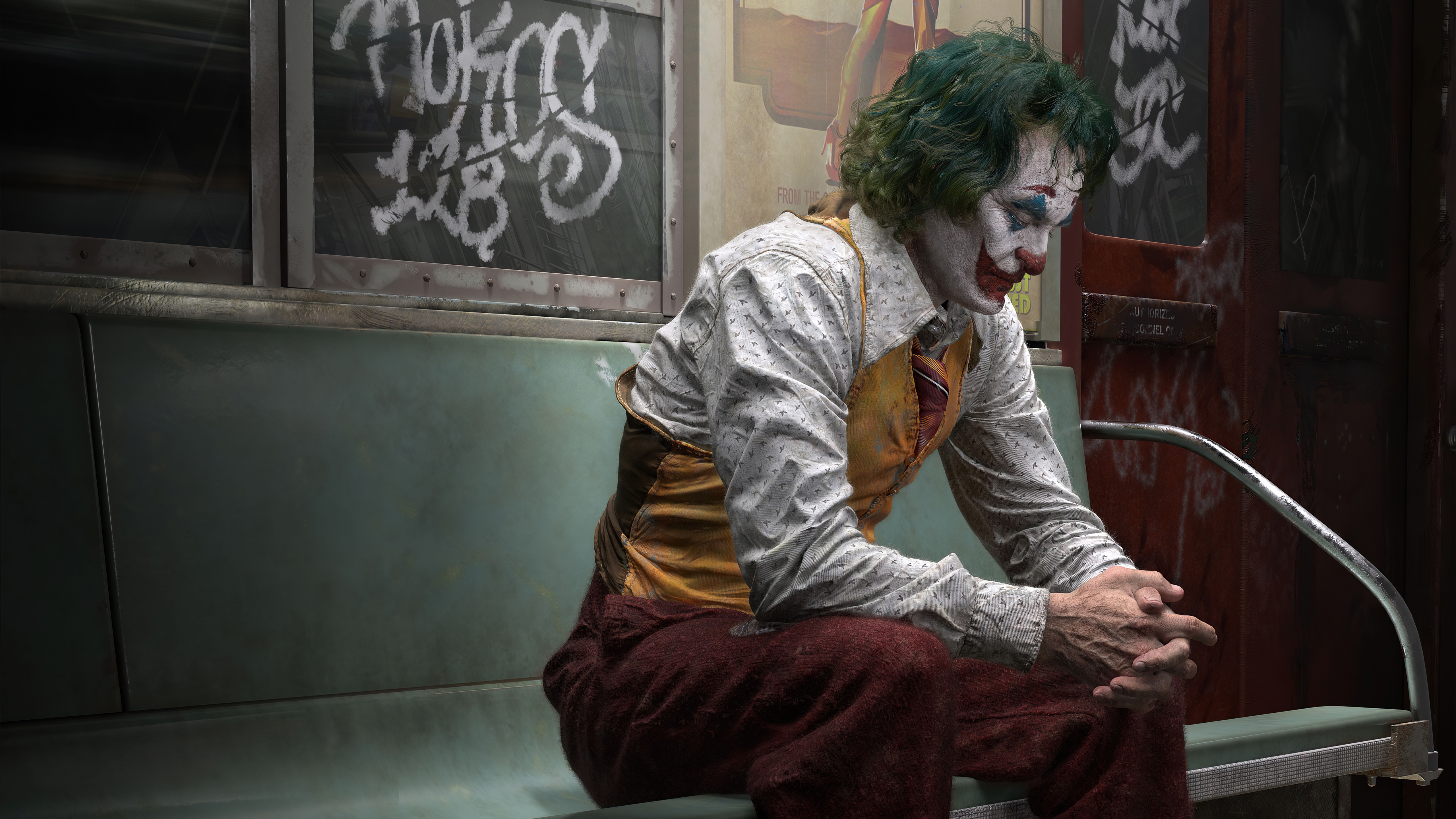 Joker sitting on a subway seat HD Wallpaper