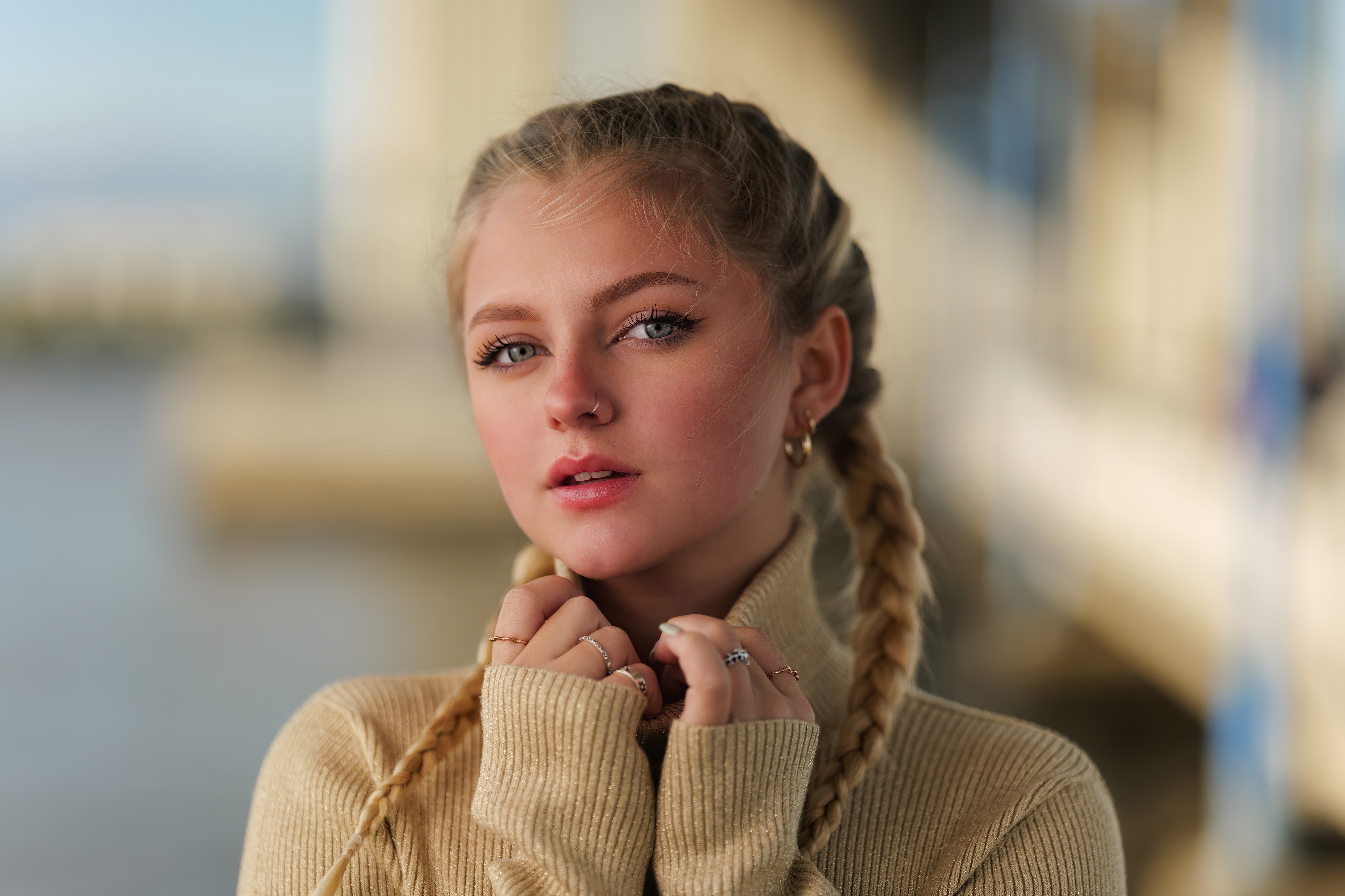 Young woman with blonde braids wearing a turtleneck HD Wallpaper