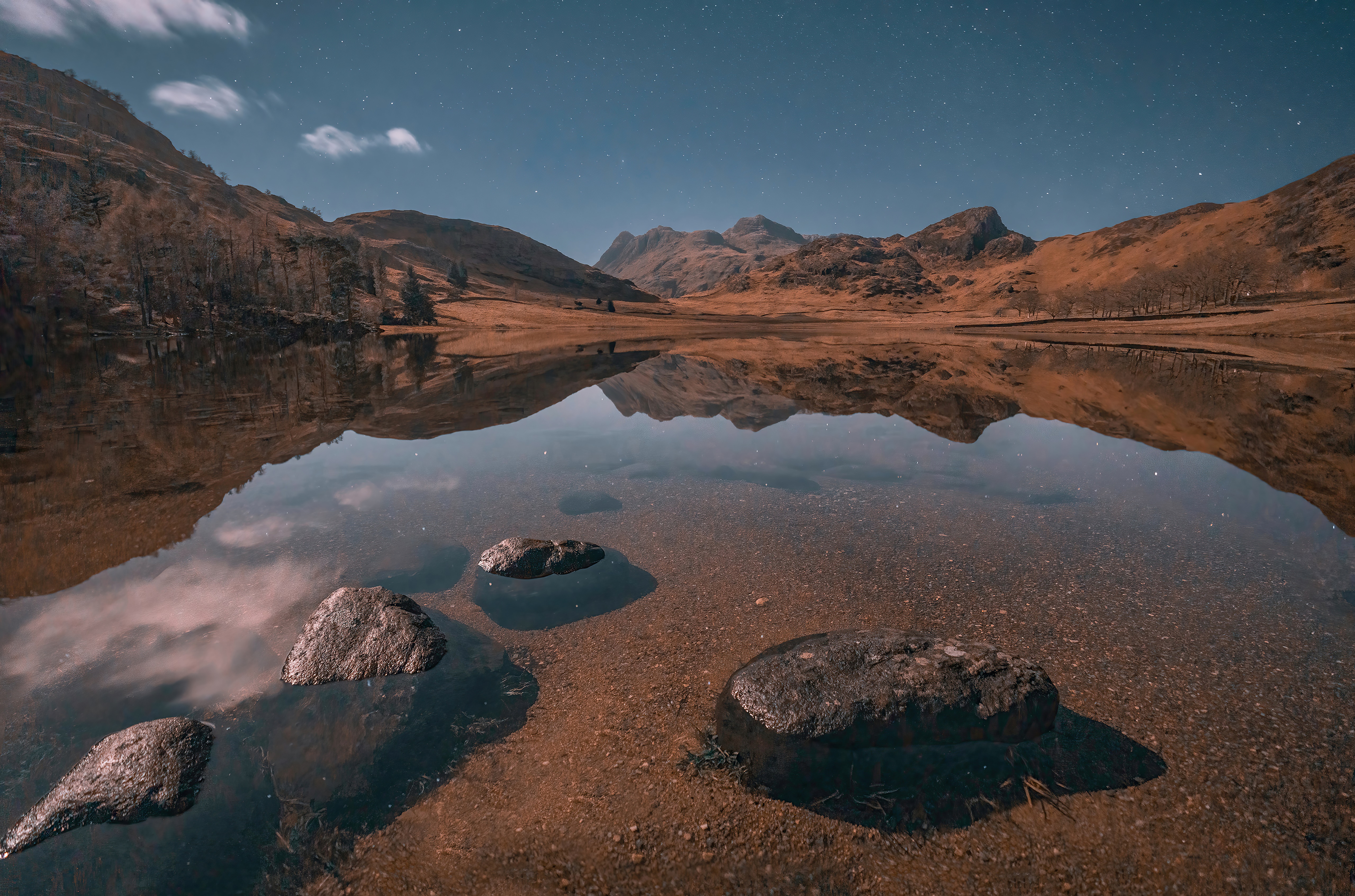 Lake with mountain reflection and rocks HD Wallpaper
