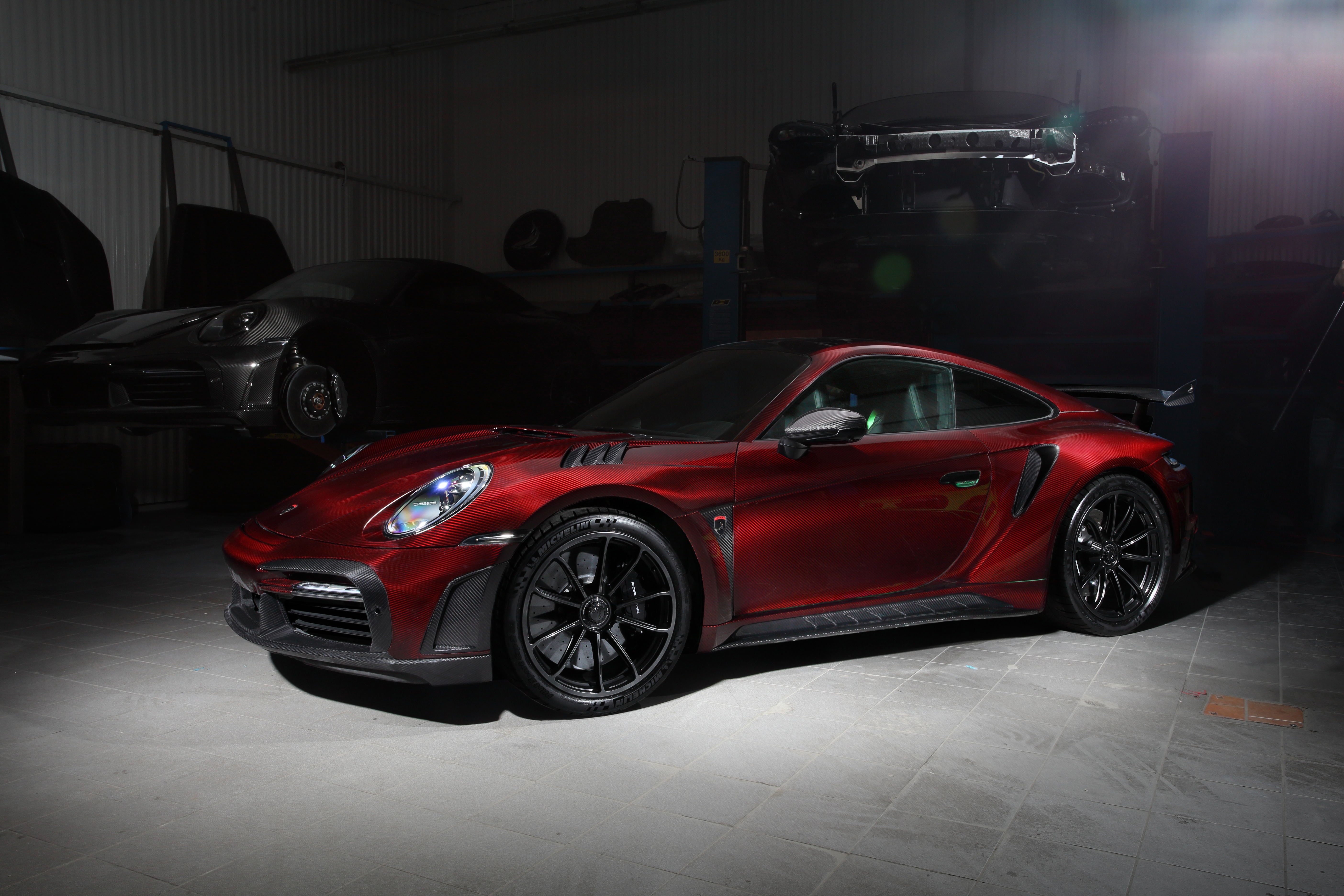 Red Porsche 911 Turbo S in a workshop HD Wallpaper