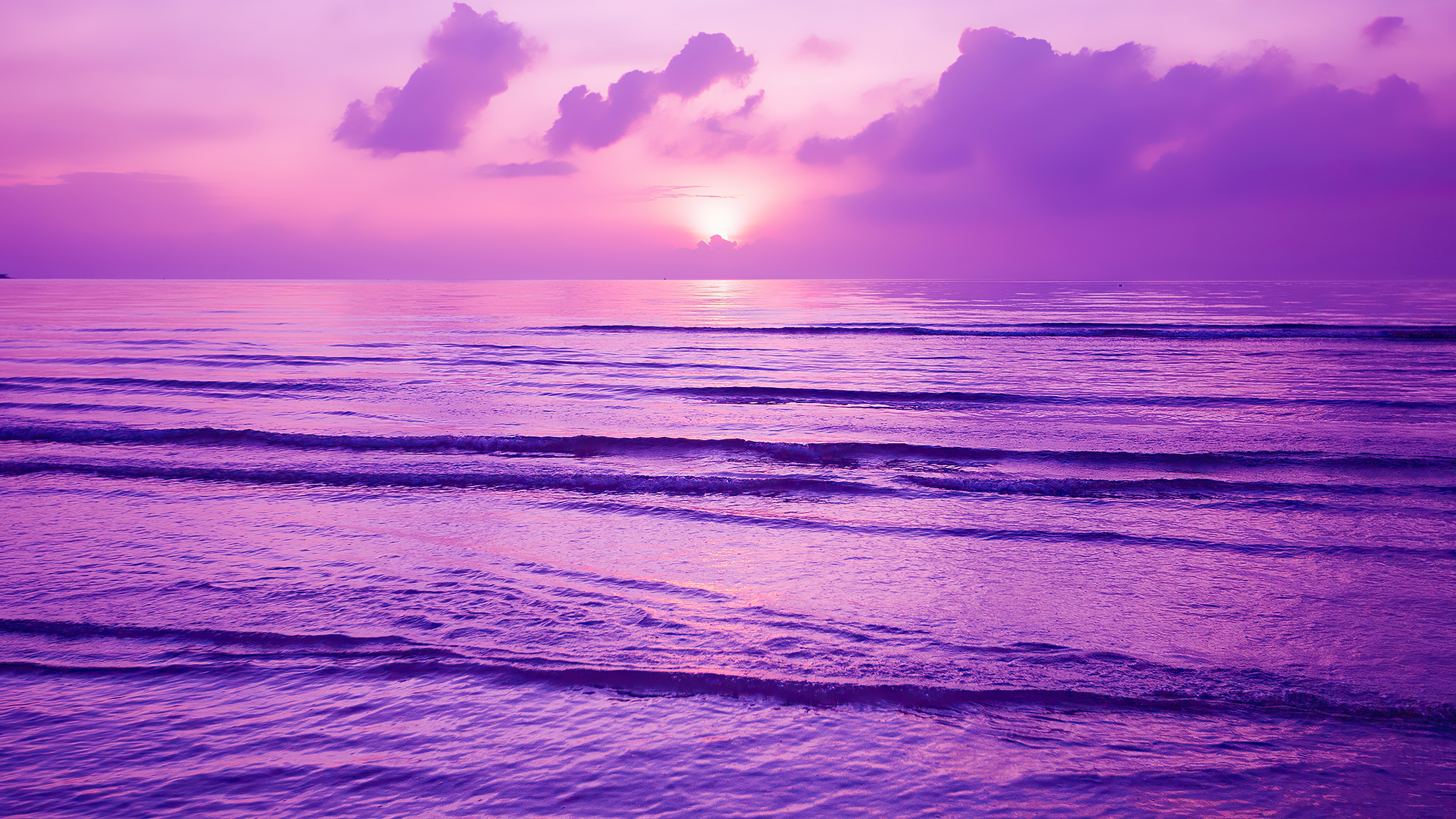 Purple sunset over the ocean with waves HD Wallpaper