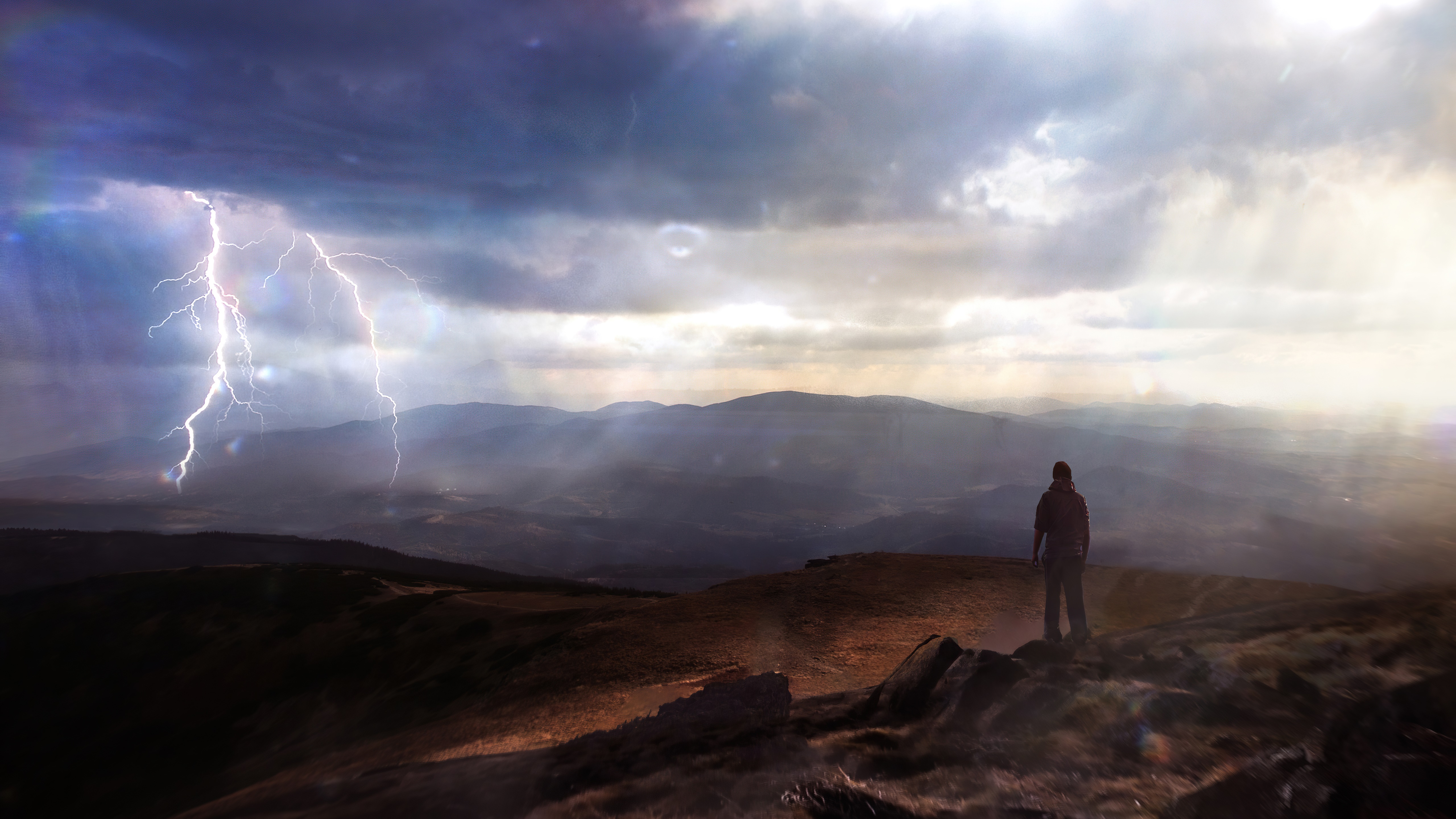 Lightning strike over mountains with a person watching HD Wallpaper