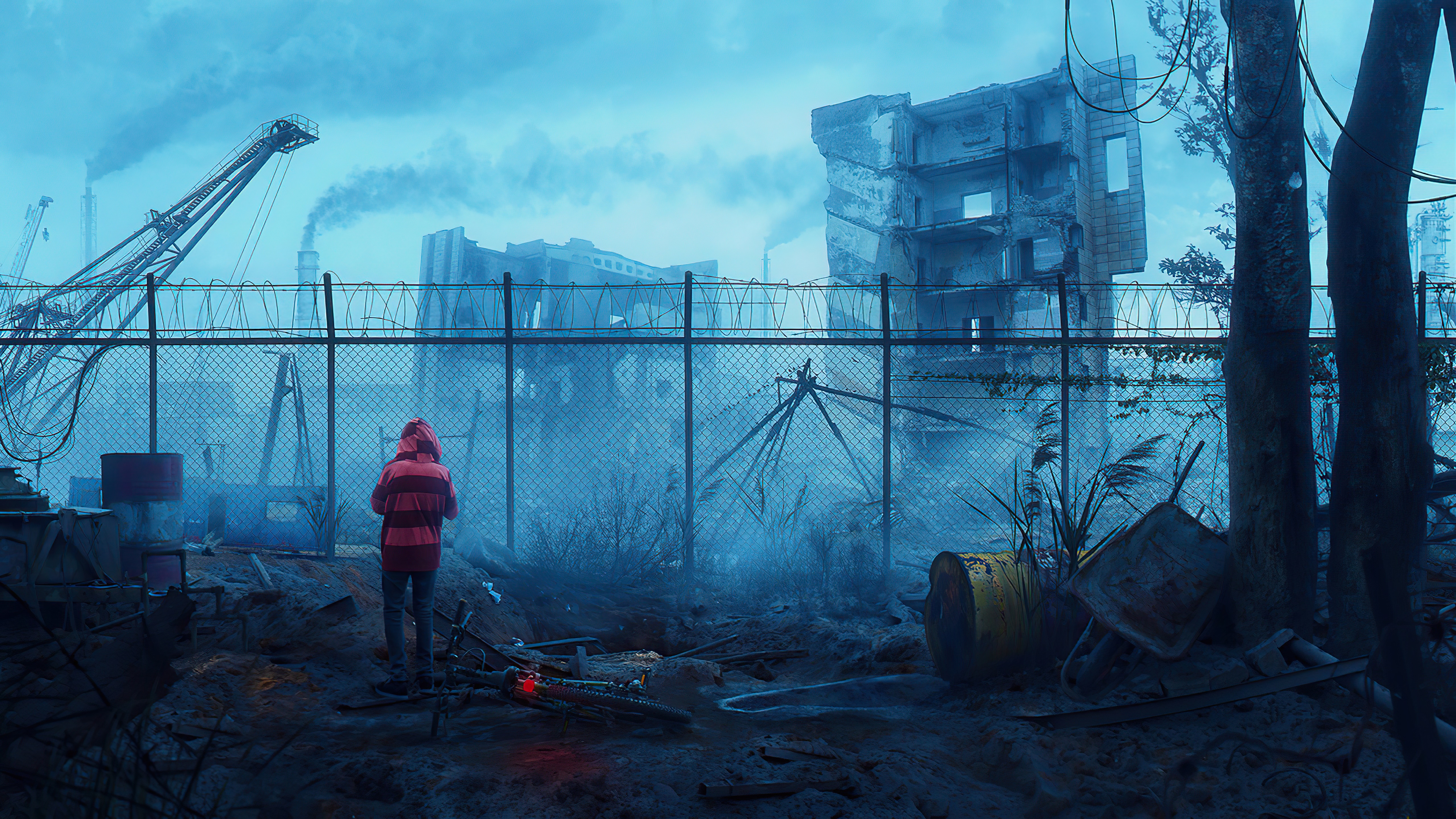 Person in red hoodie in industrial wasteland HD Wallpaper