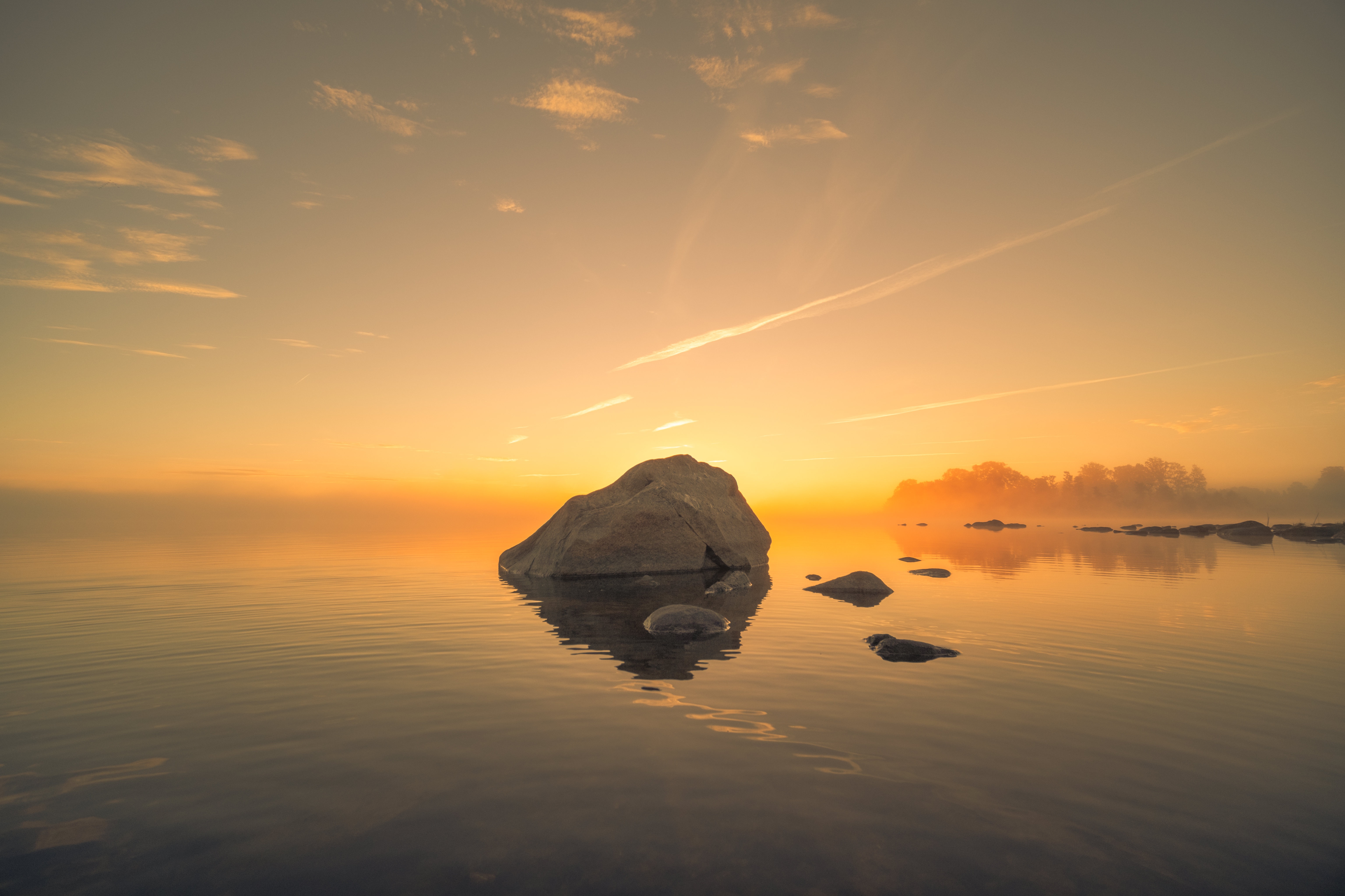 Rock in the water at sunset HD Wallpaper