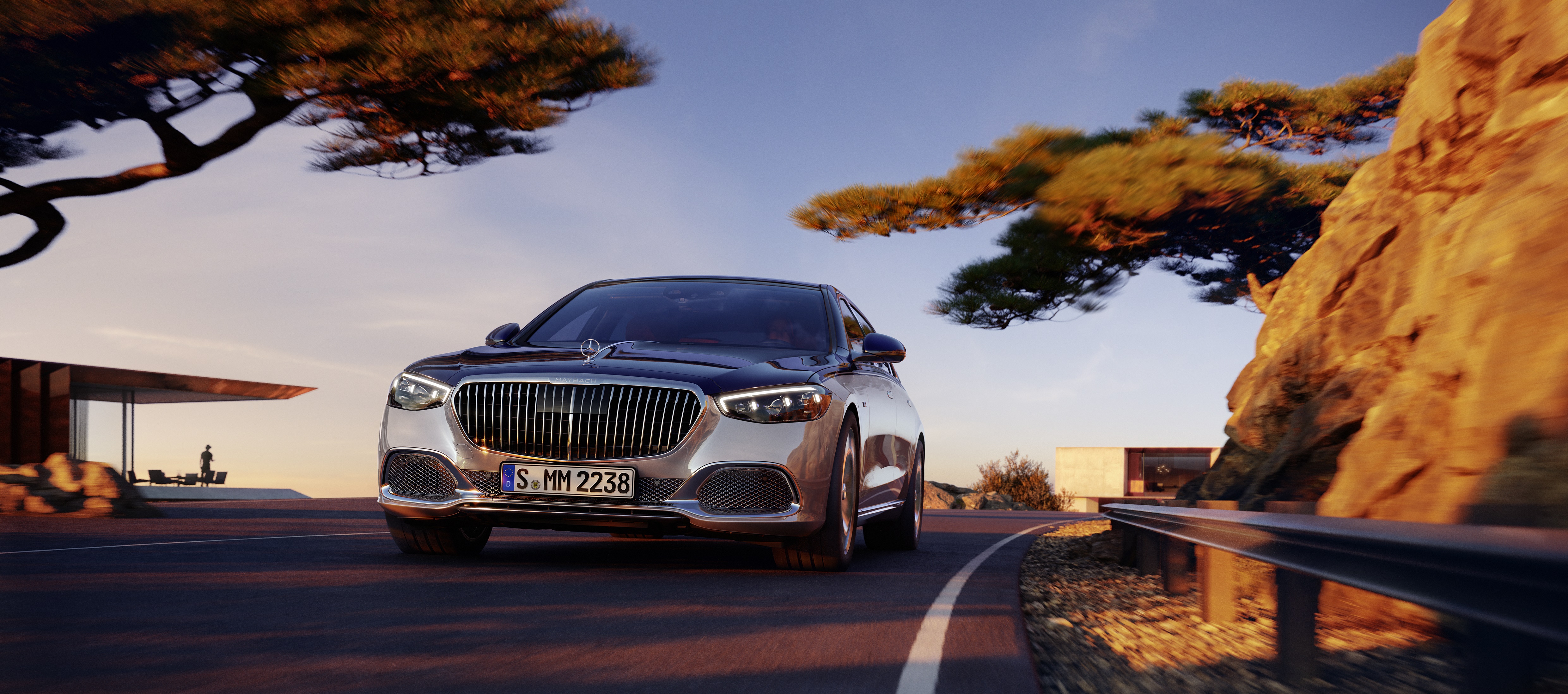 Mercedes-Maybach S-Class driving on a scenic road HD Wallpaper