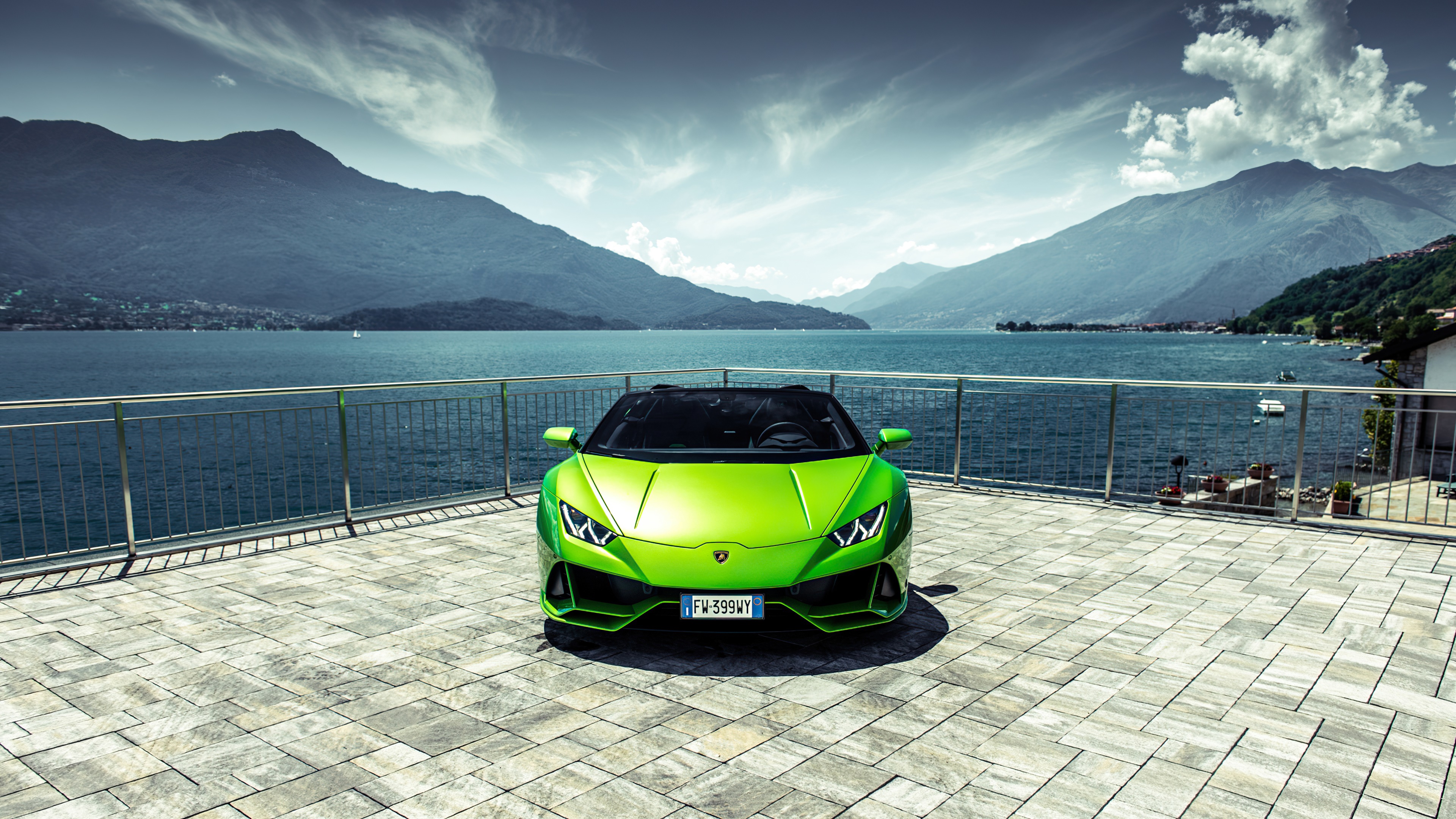 Green Lamborghini Huracan Evo on a terrace by a lake HD Wallpaper
