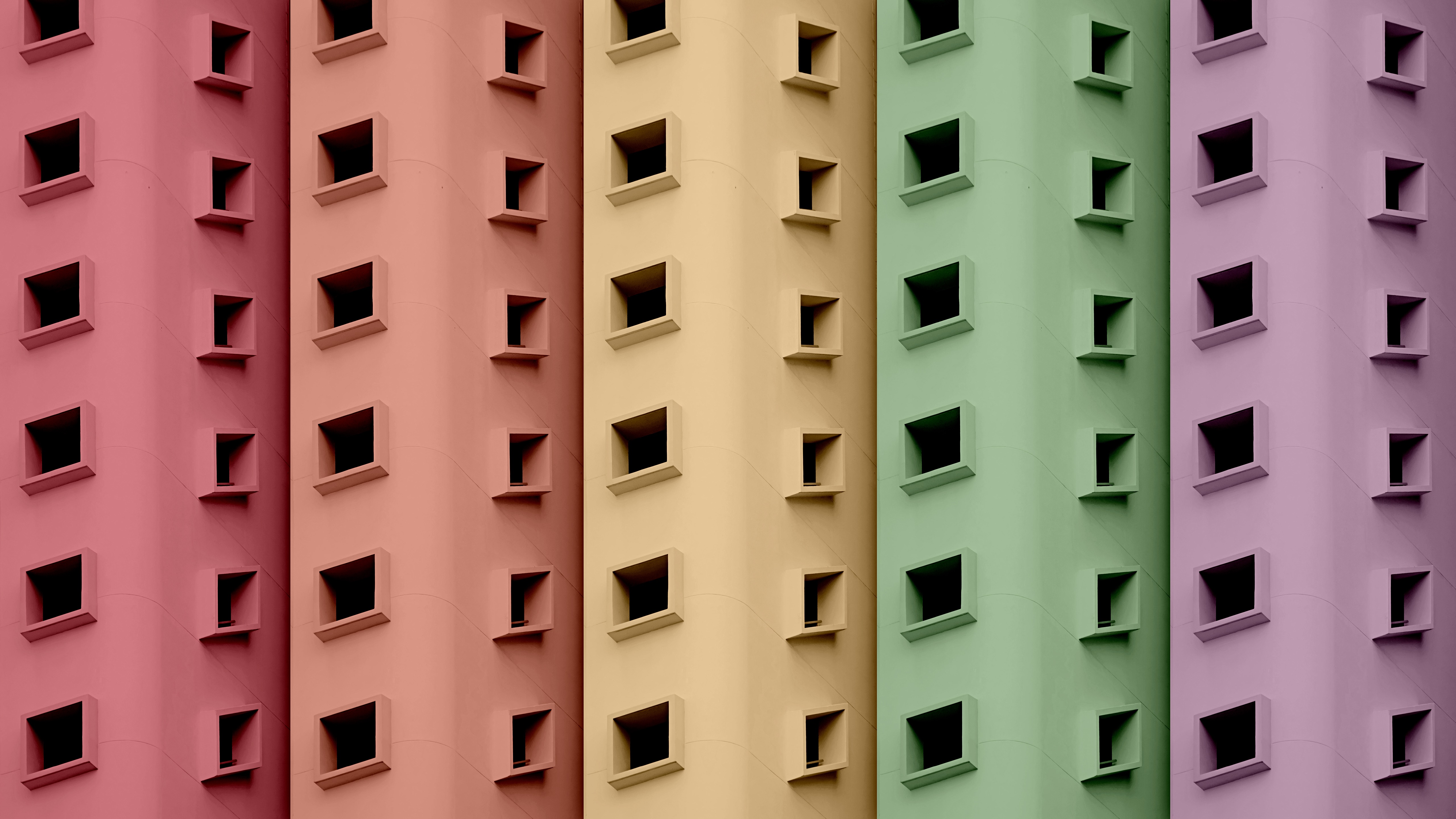 Minimalist building facades with colorful sections and square windows HD Wallpaper